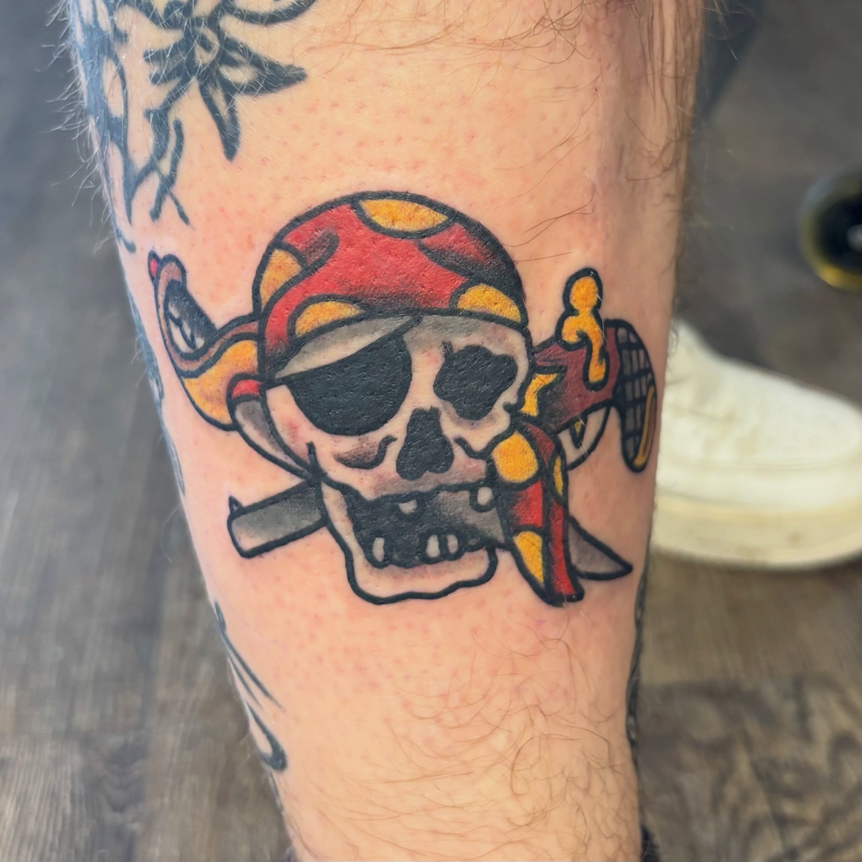 Pirate skull American traditional tattoo on the forearm by Las Vegas Tattoo Artist
