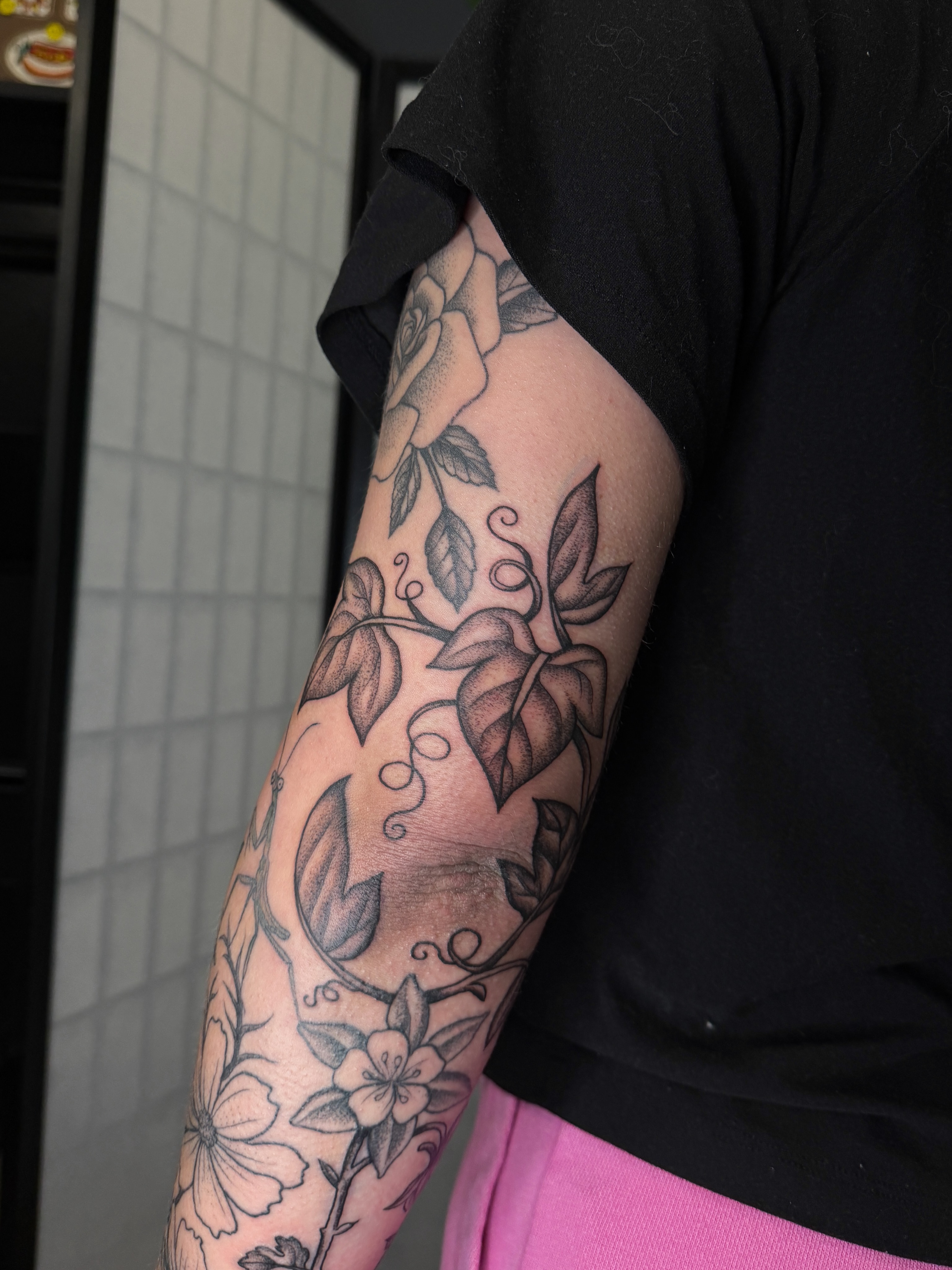 Floral vine black and grey tattoo on the forearm by Hannah Eddy