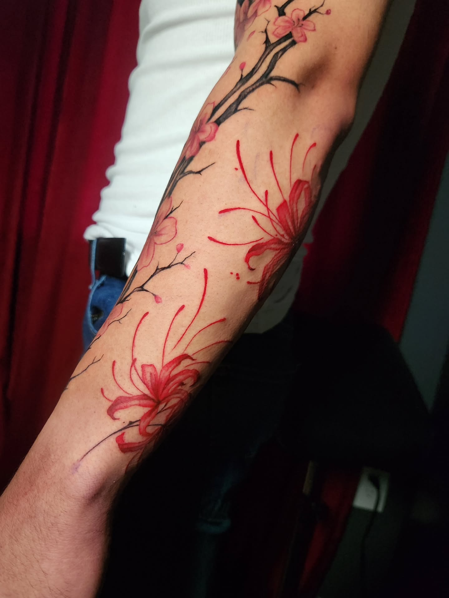 Cherry blossoms watercolor tattoo on the forearm by Abby Renteria
