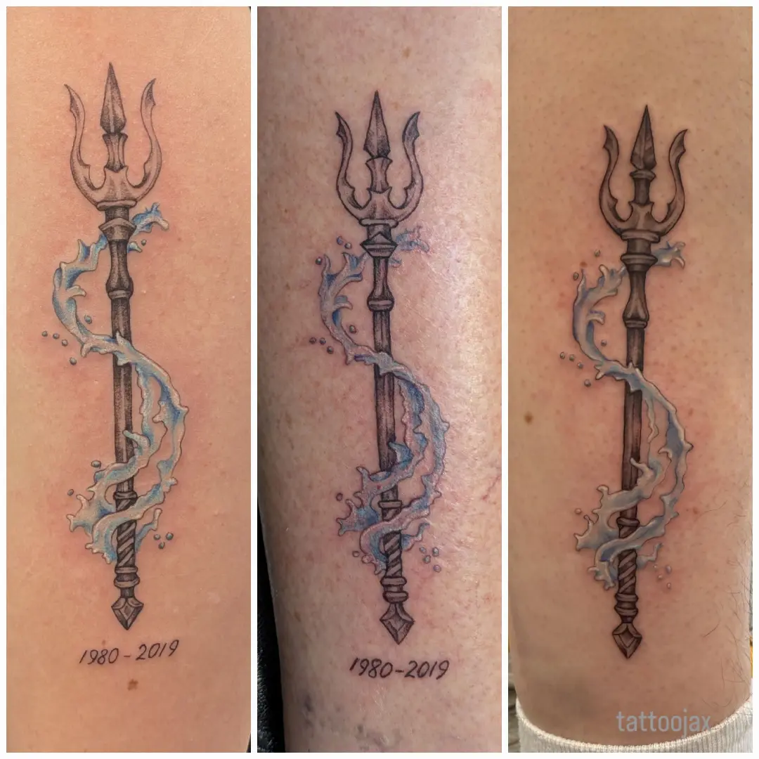 Trident black and grey tattoo on the upper arm by jackie
