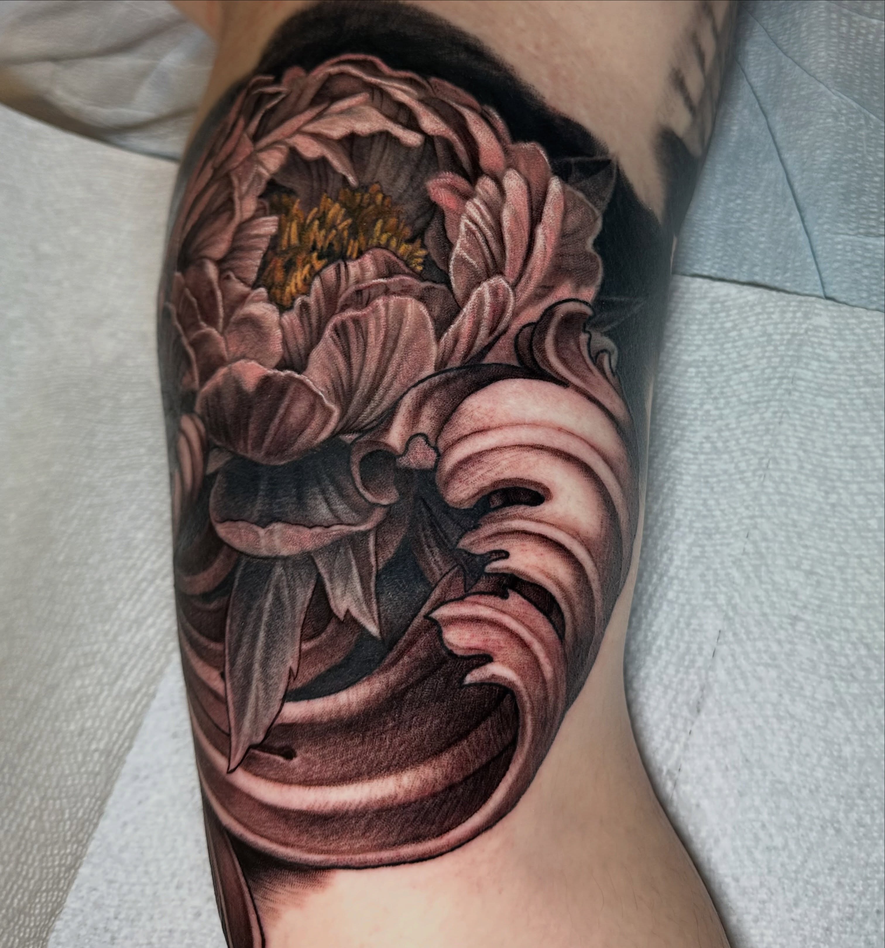 Peony realism tattoo on the forearm by shane baker