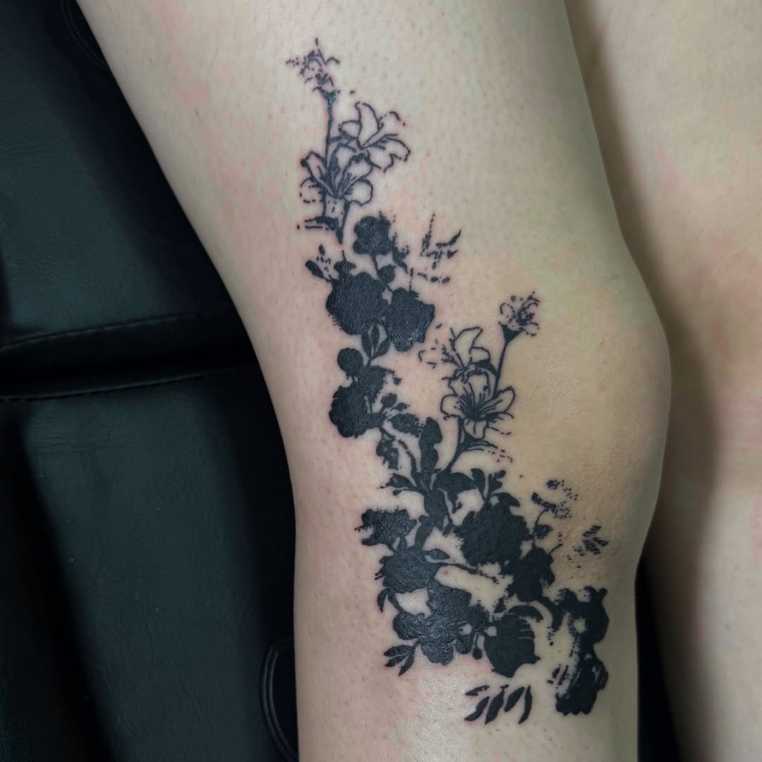 Floral arrangement black and grey tattoo on the forearm by 🌸Blossom🌸