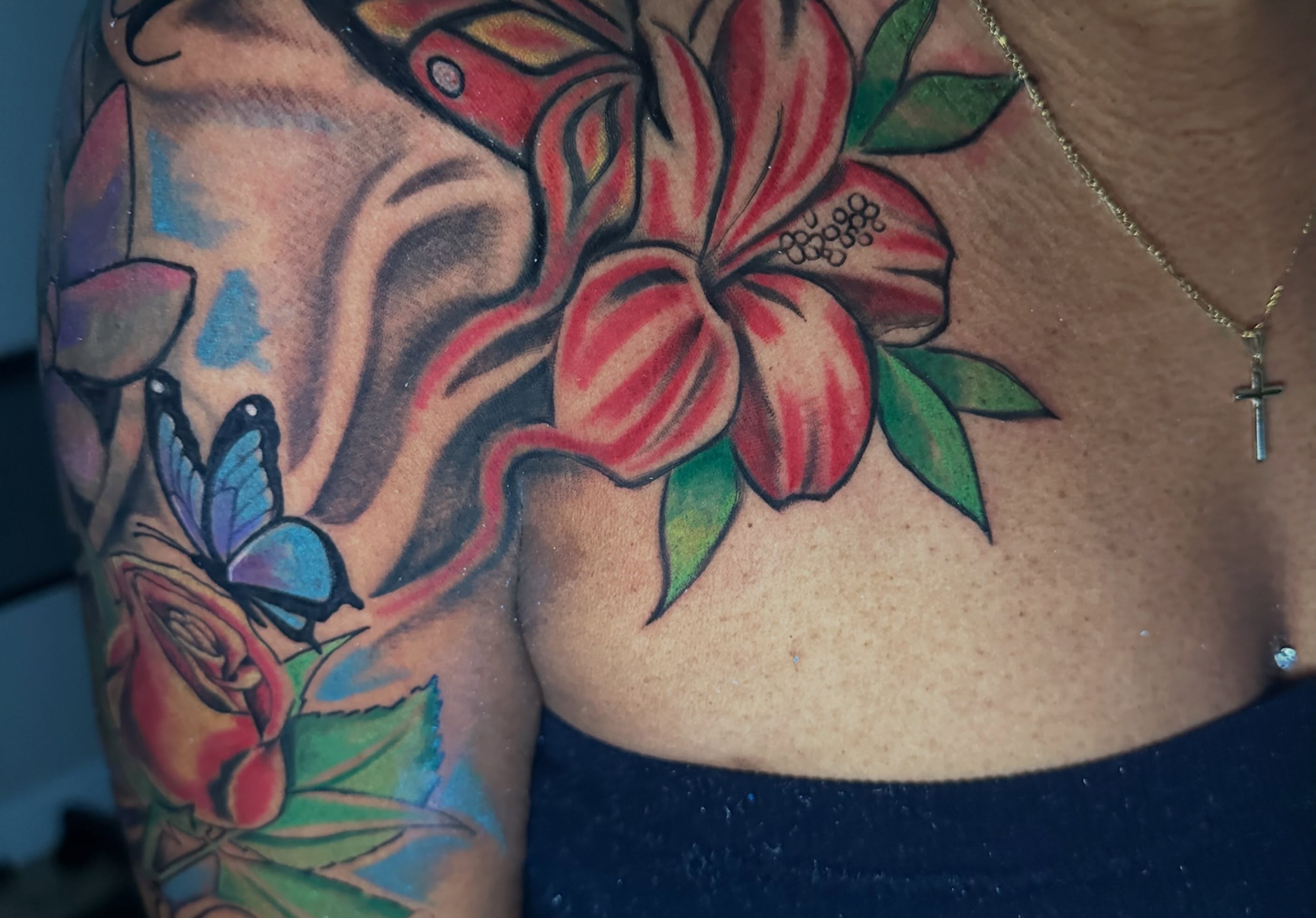 Flower and butterfly American traditional tattoo on the shoulder by I Am Mawlo! Welcome Fellow Mawlonians