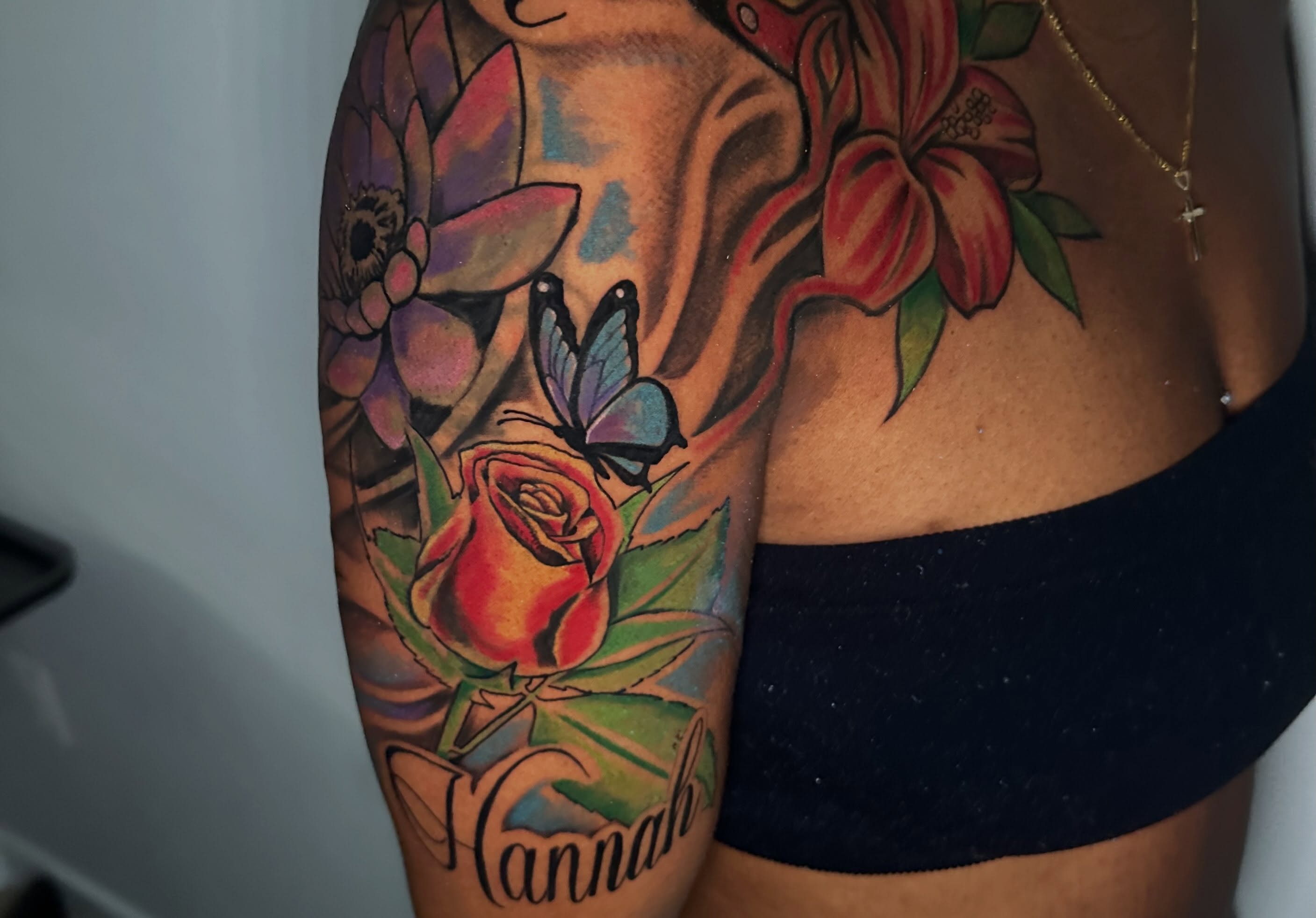 Flower and butterfly realism tattoo on the upper arm by I Am Mawlo! Welcome Fellow Mawlonians