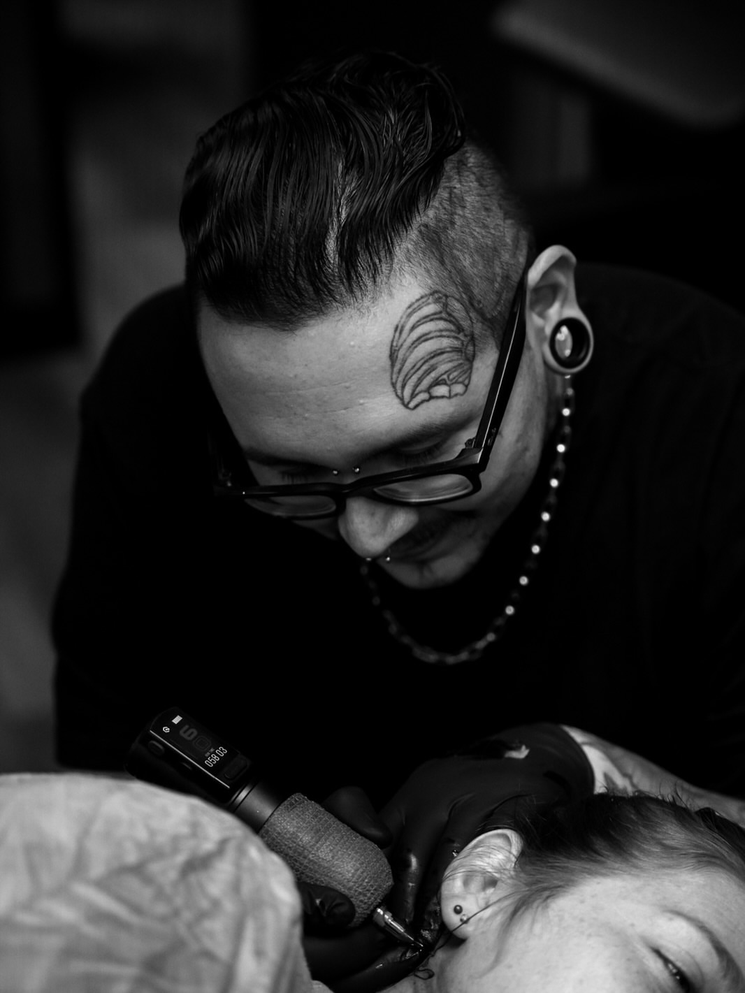 Wave black and grey tattoo on the head by Ray De Leon