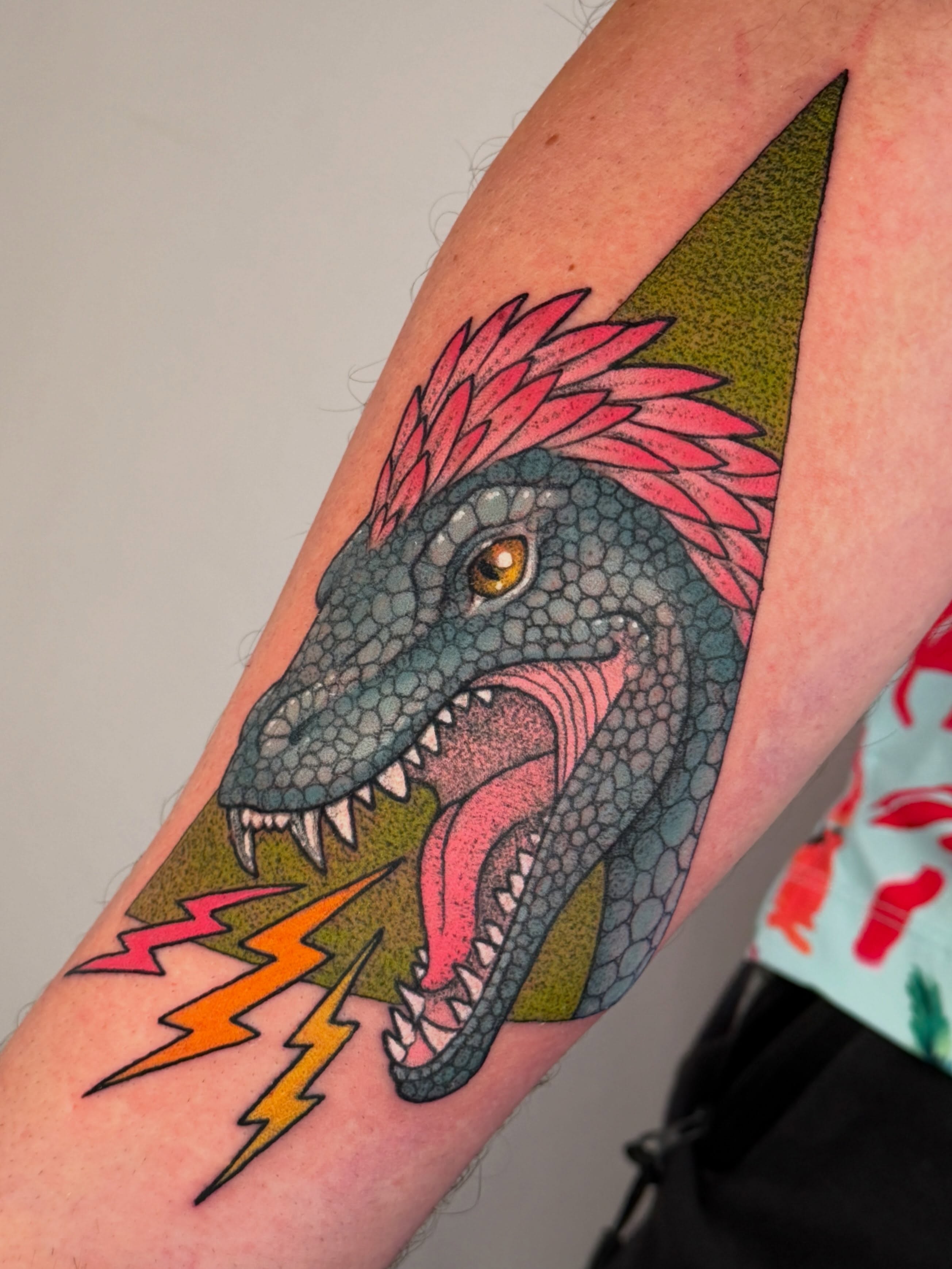 Dinosaur American traditional tattoo on the forearm by leanna patterson, Ruston, Louisiana