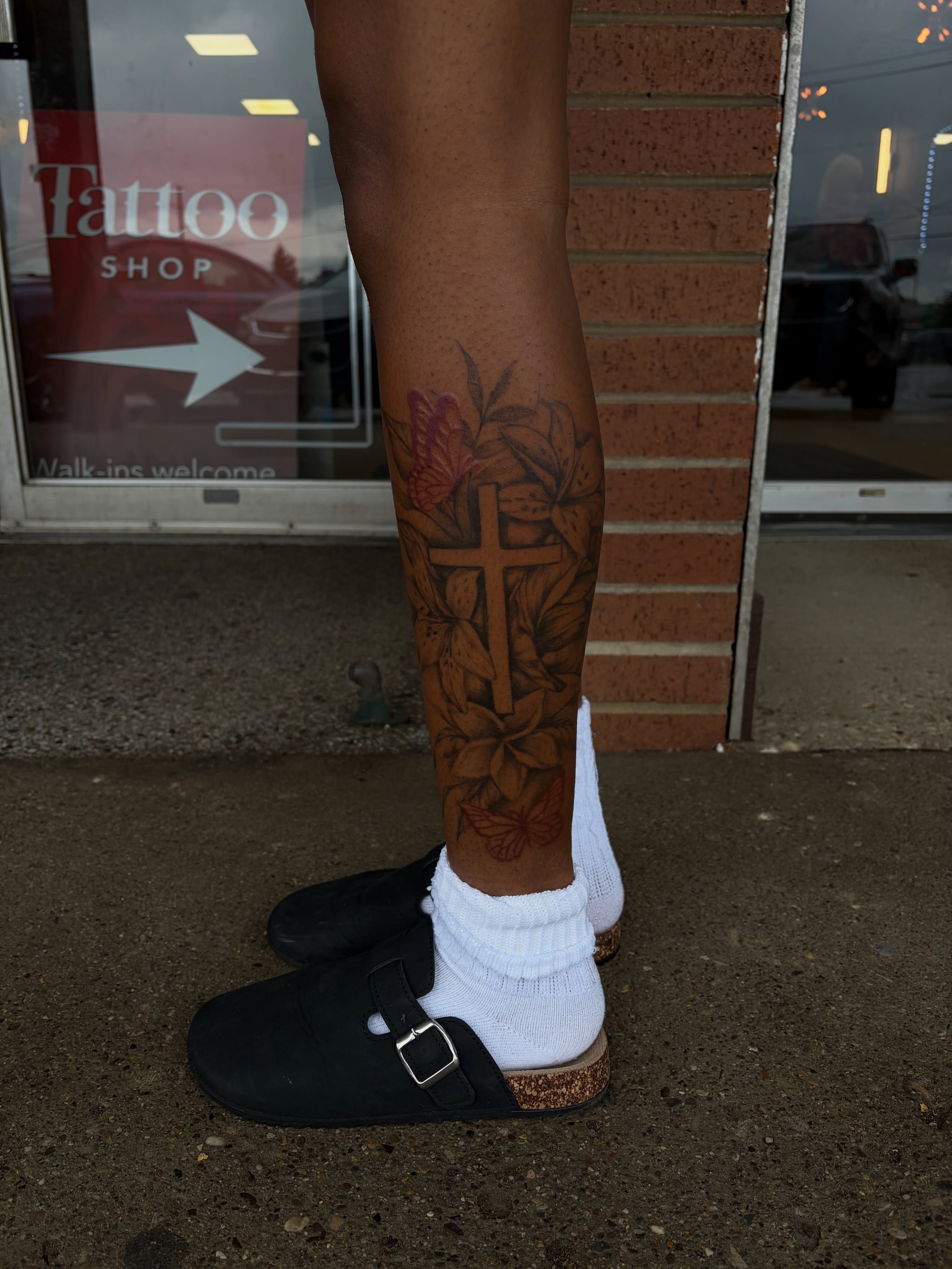 Cross and floral American traditional tattoo on the forearm by ⚜️Embodied Tattoo⚜️, Columbus, Ohio