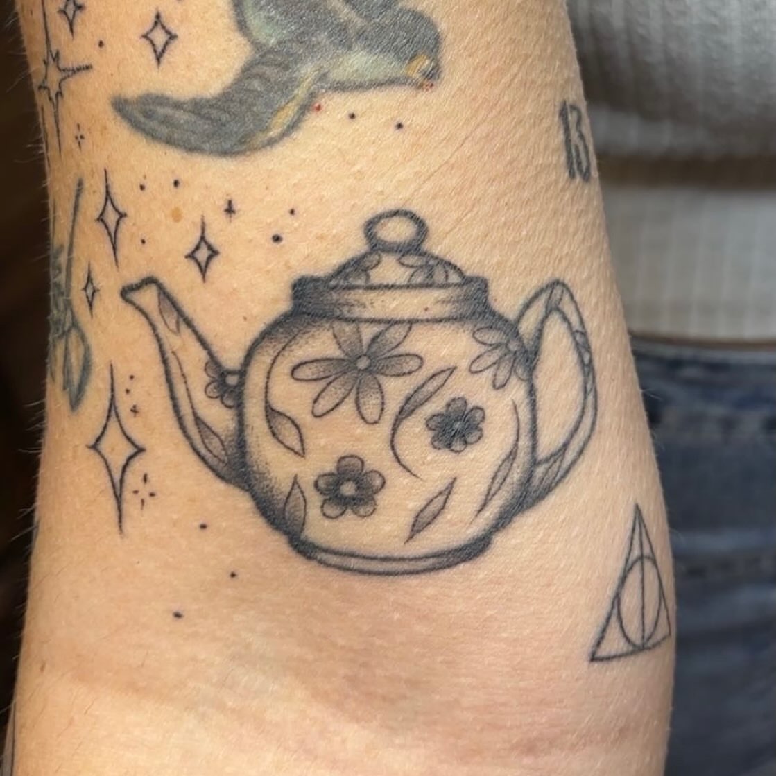 Teapot black and grey tattoo on the forearm by Molly Dixon