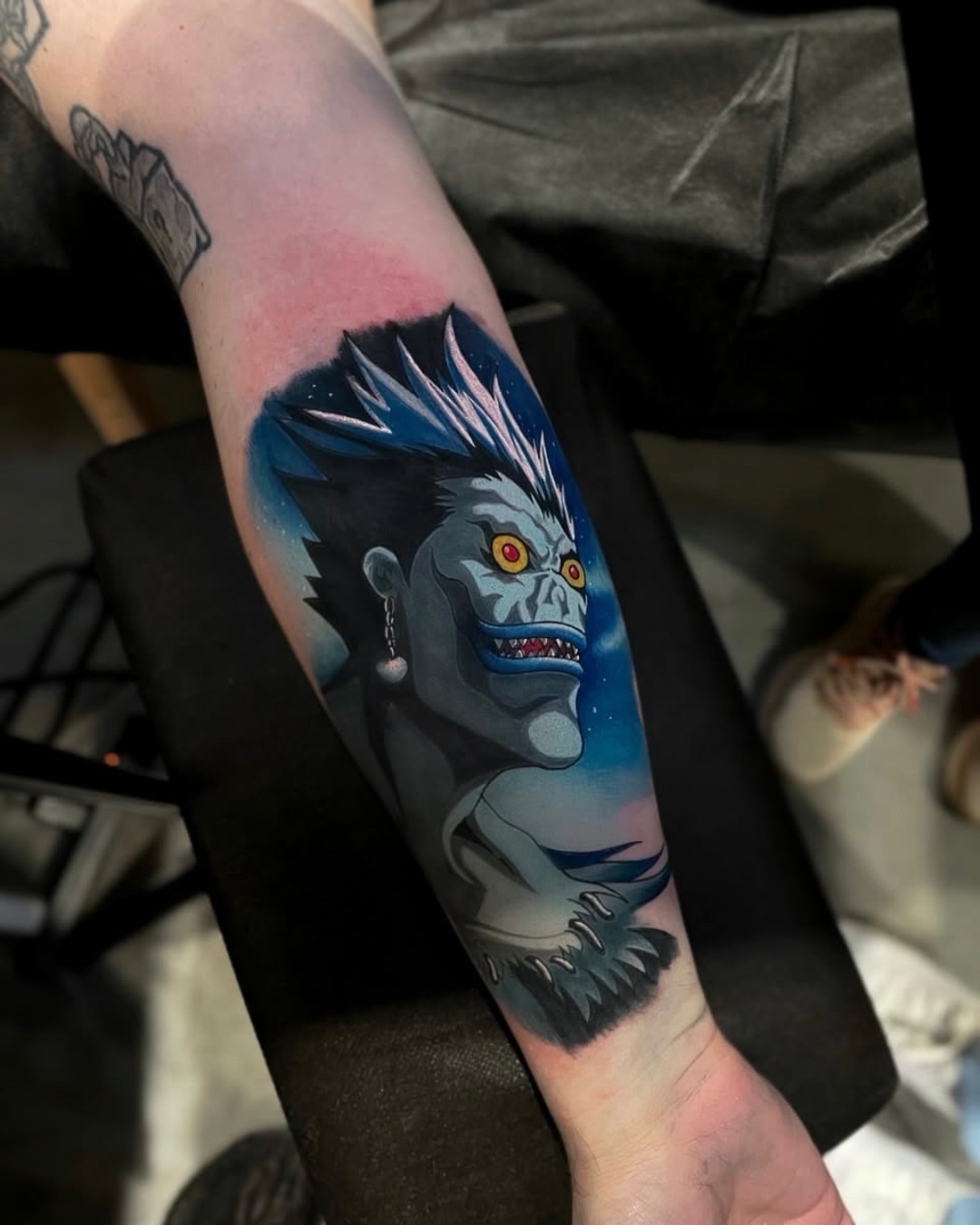 Ogre anime tattoo on the forearm by Edward best