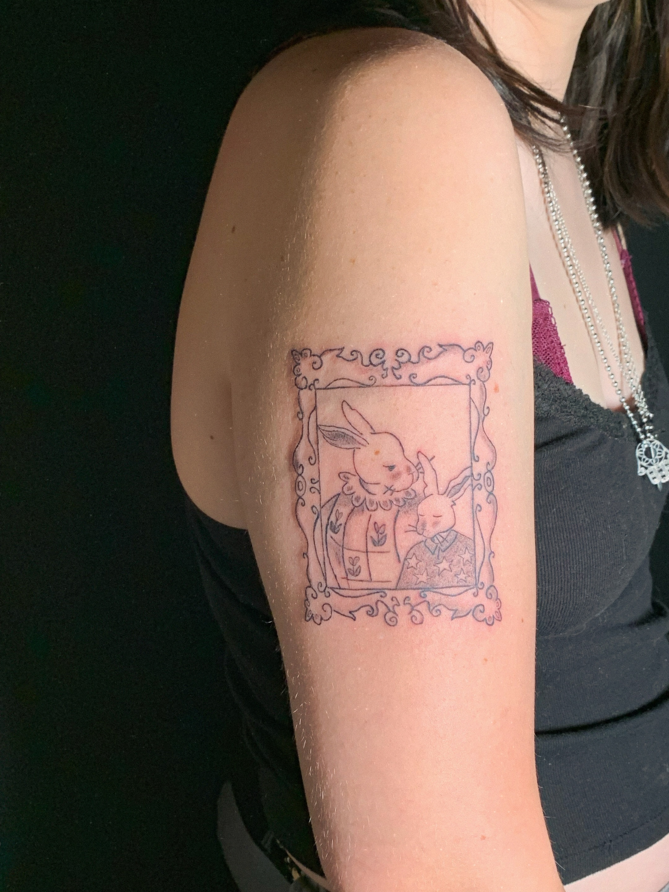 Rabbit and flowers illustrative tattoo on the forearm by charles