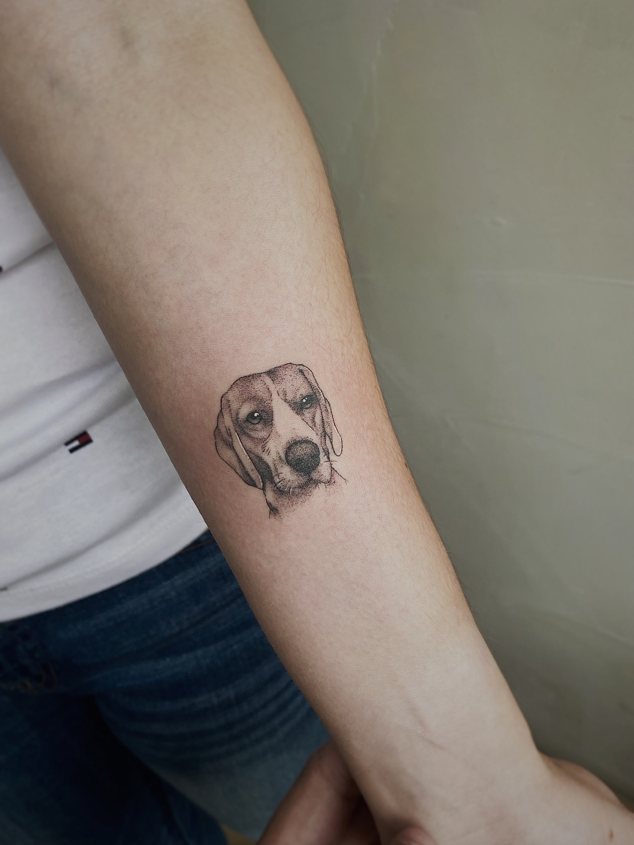 Dog head dotwork tattoo on the forearm by Fabian Hellberg