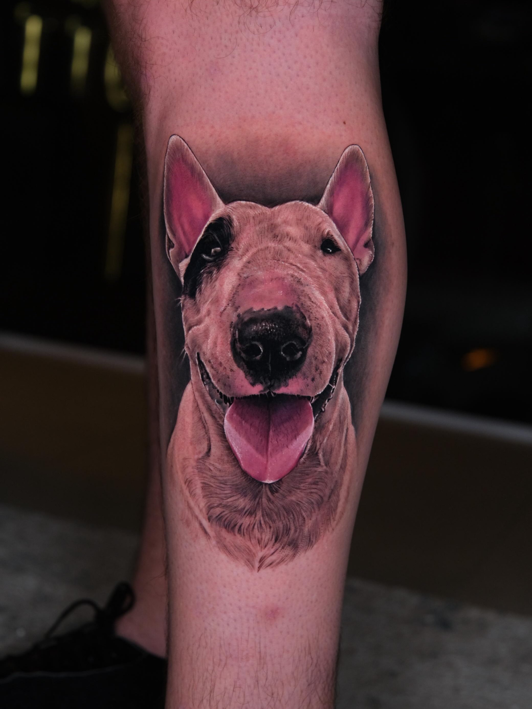 Dog realism tattoo on the forearm by Fabian Hellberg
