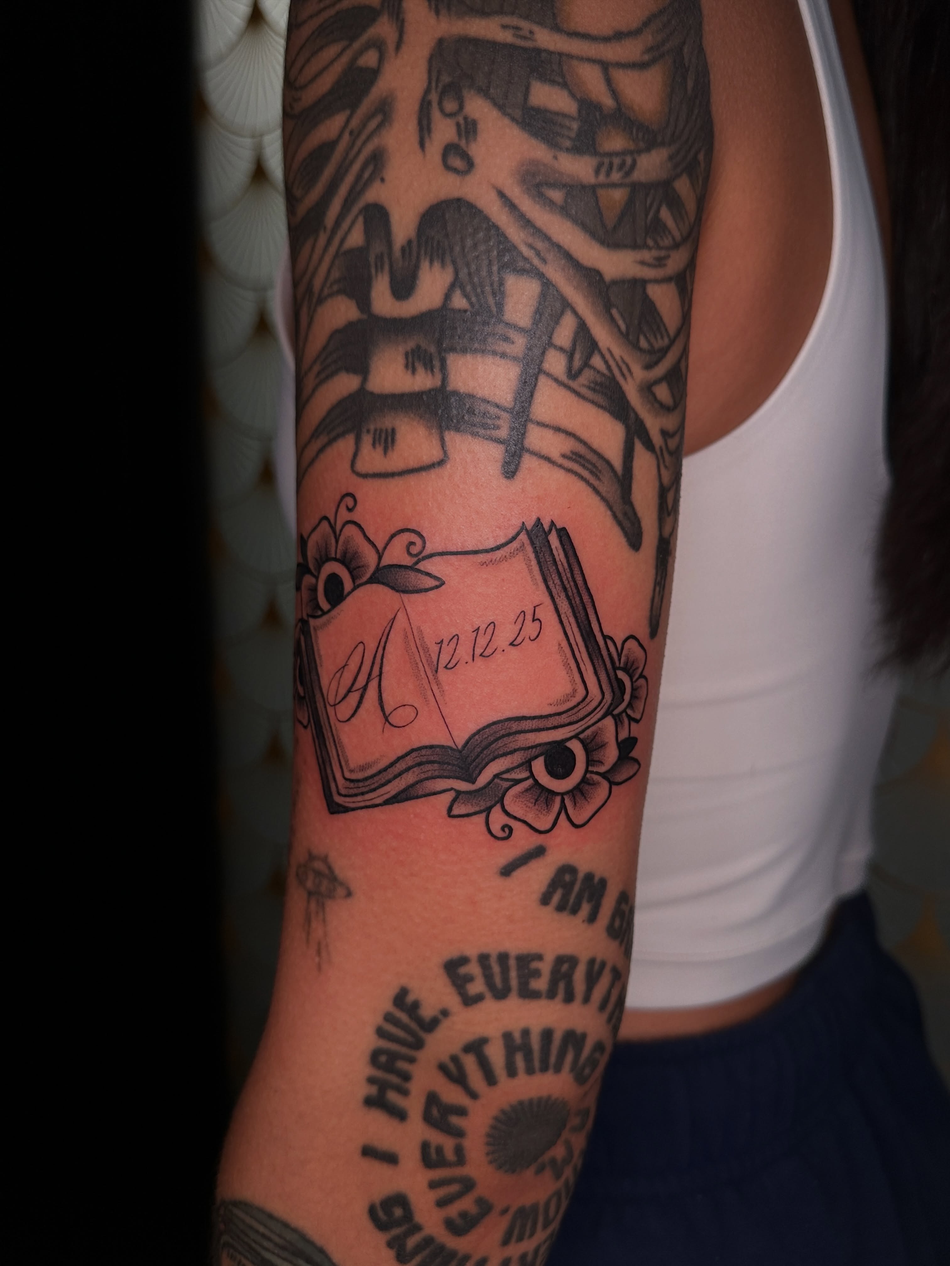 Book with date black and grey tattoo on the forearm by ⊹₊⟡⋆ 𝕵𝖔𝖎𝖊 ⊹₊⟡⋆