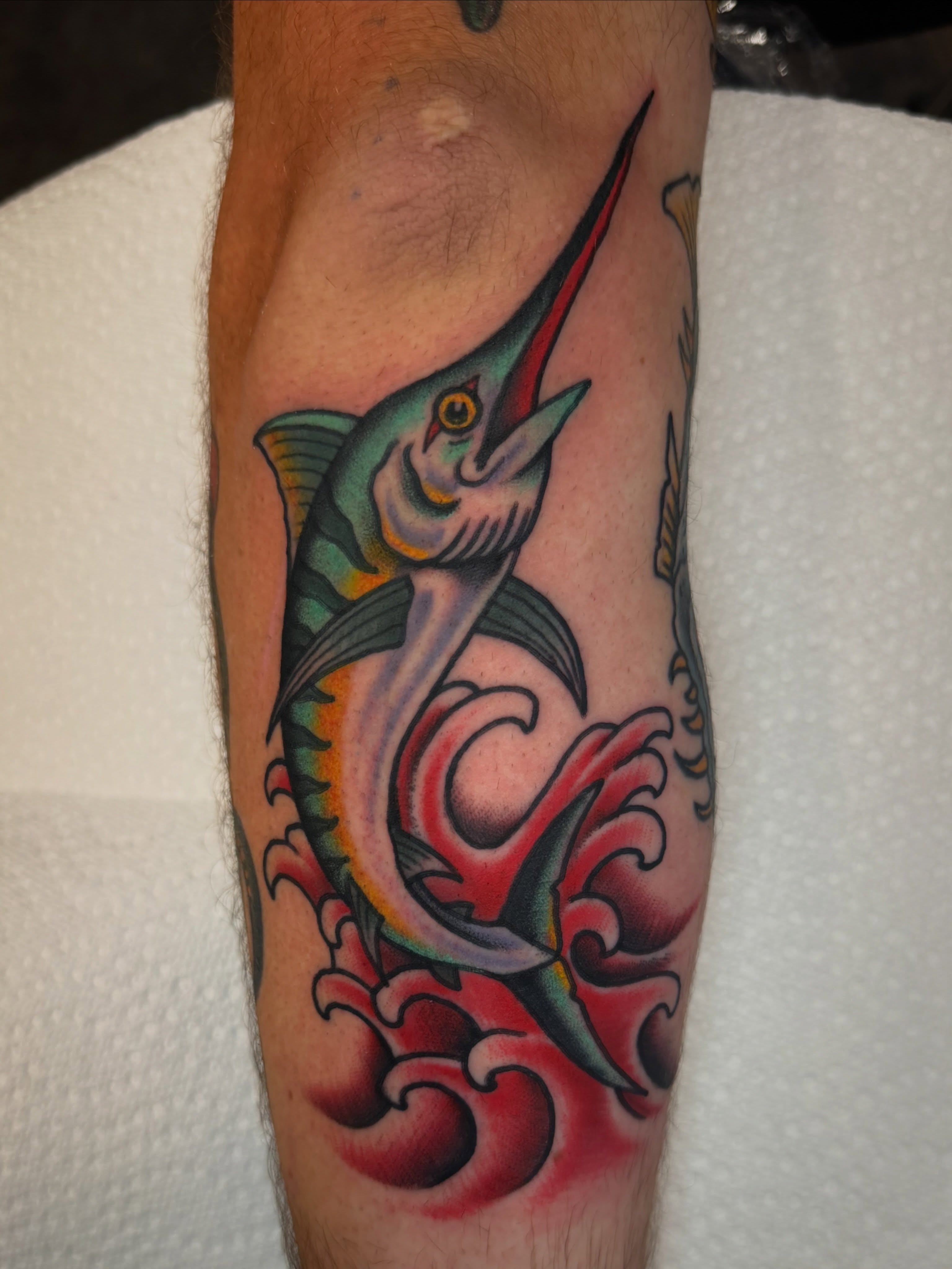 Marlin American traditional tattoo on the forearm by Christopher Mikesell