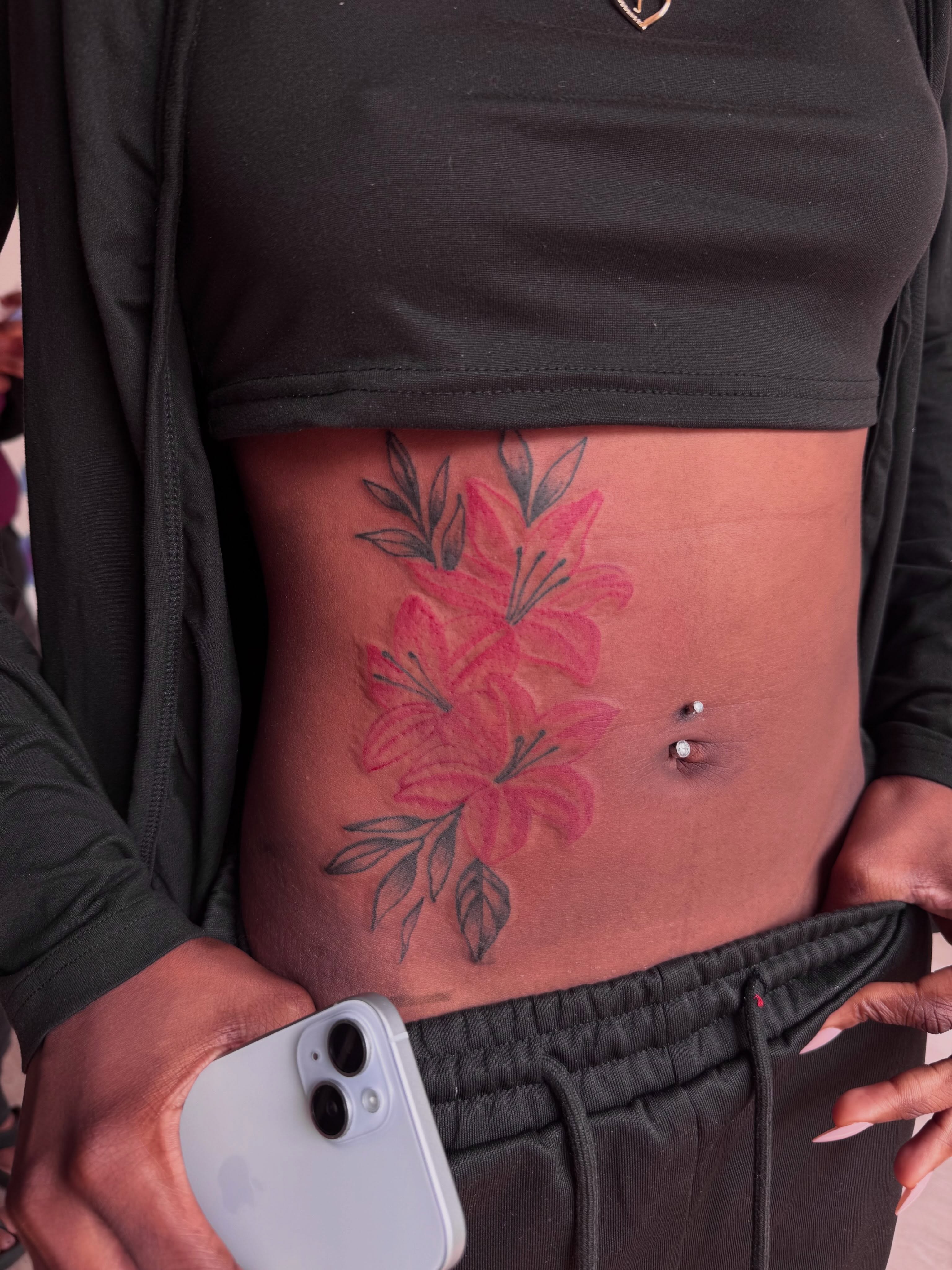 Lilies black and grey tattoo on the torso by inkedbylii, Philadelphia, Pennsylvania