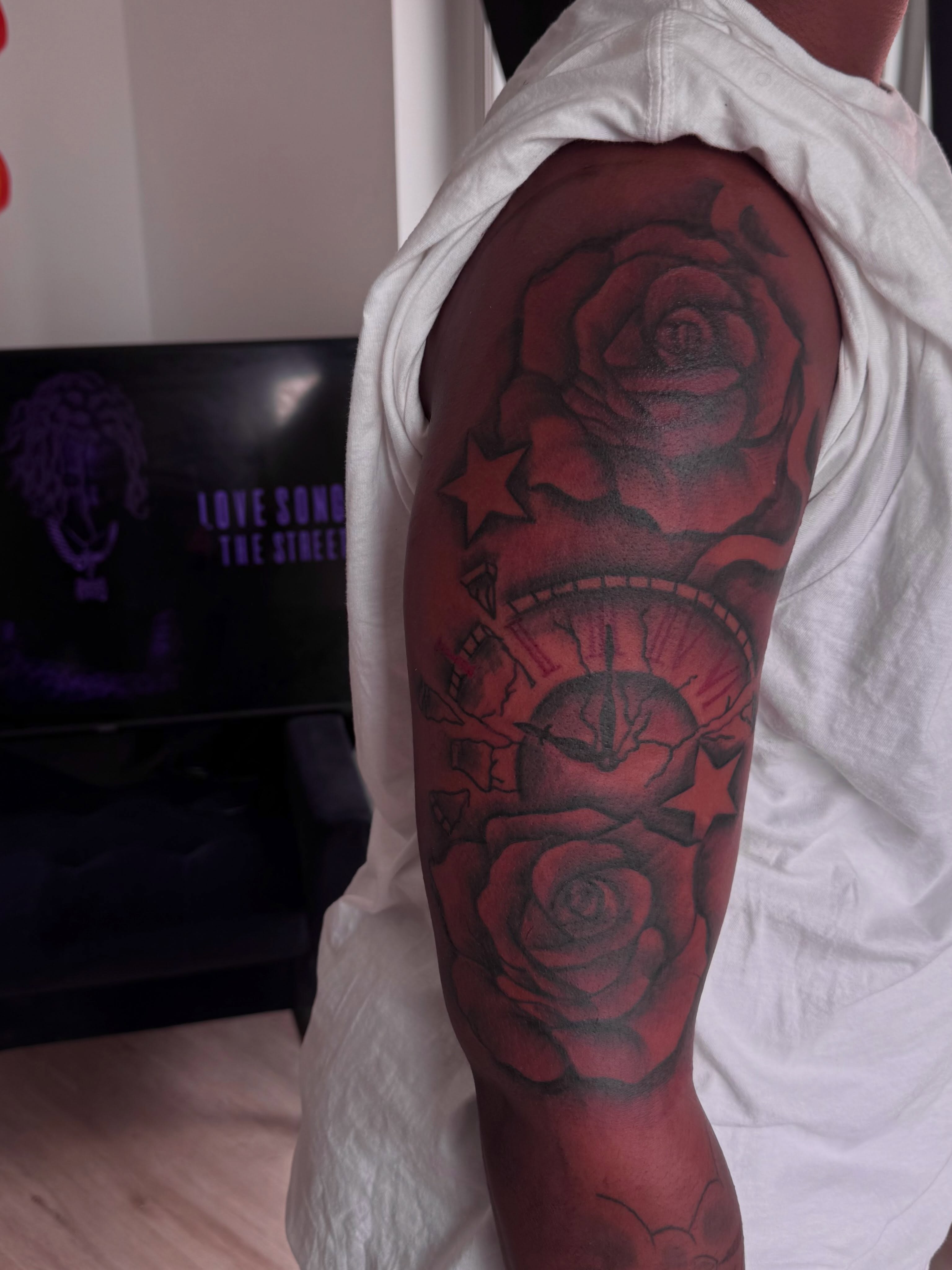 Red roses black and grey tattoo on the upper arm by inkedbylii, Philadelphia, Pennsylvania