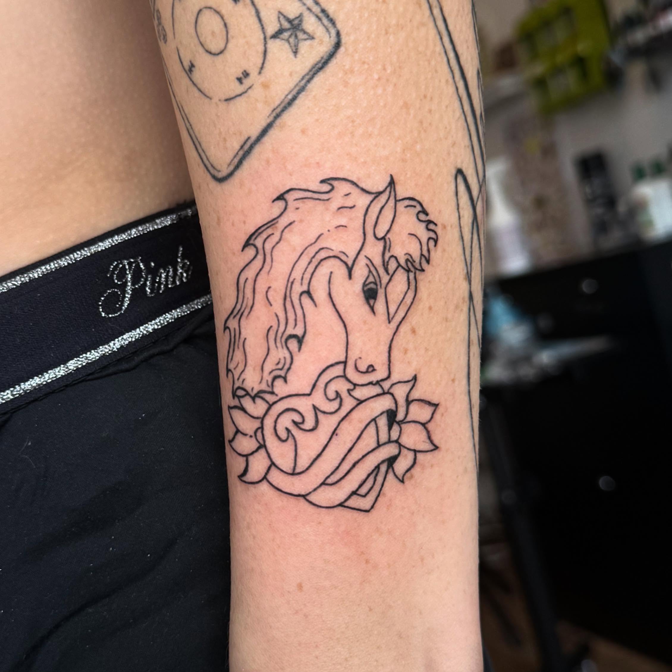 Horse and floral black and grey tattoo on the forearm by house0fsleep 💤