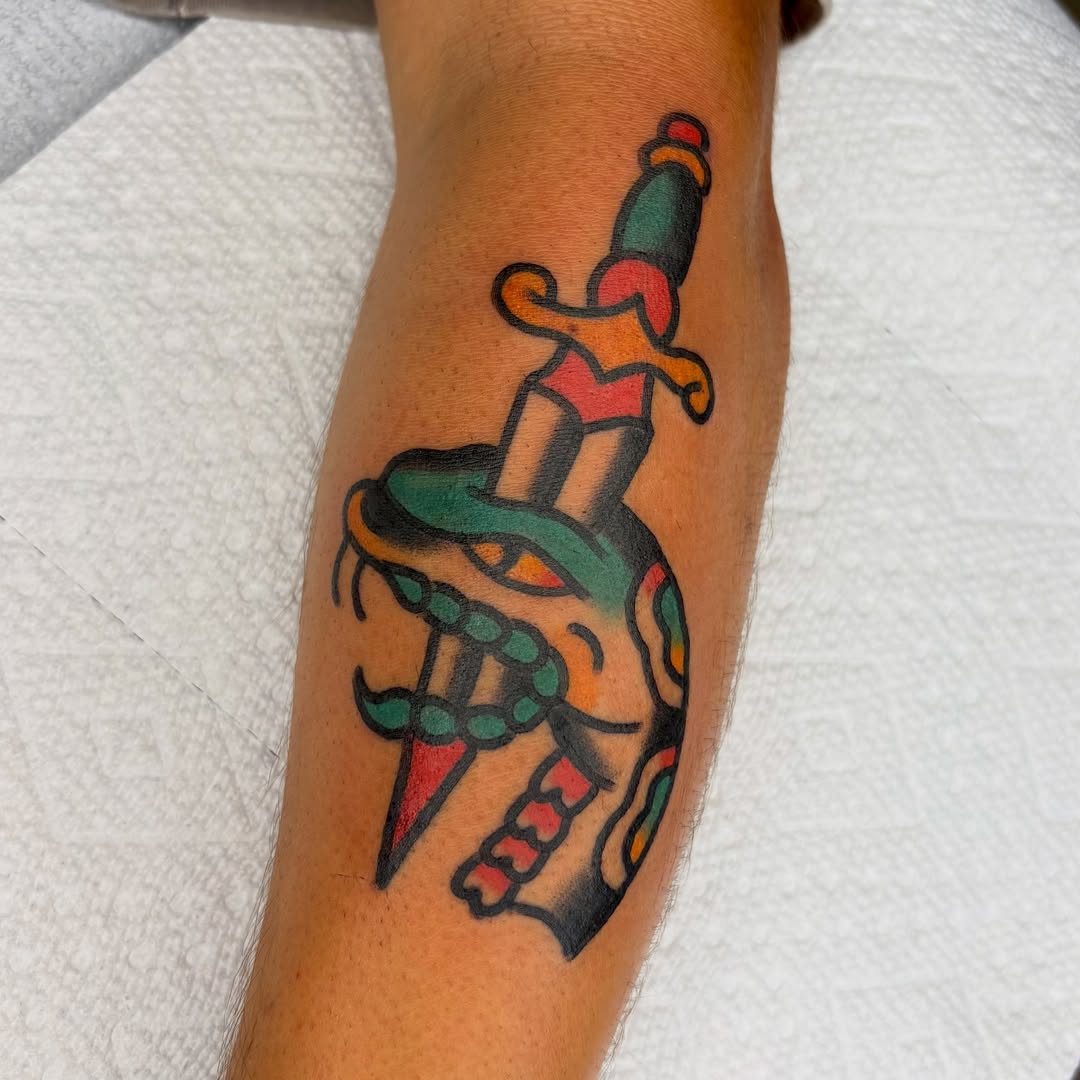 Heart with dagger American traditional tattoo on the forearm by Braedon 🎱
