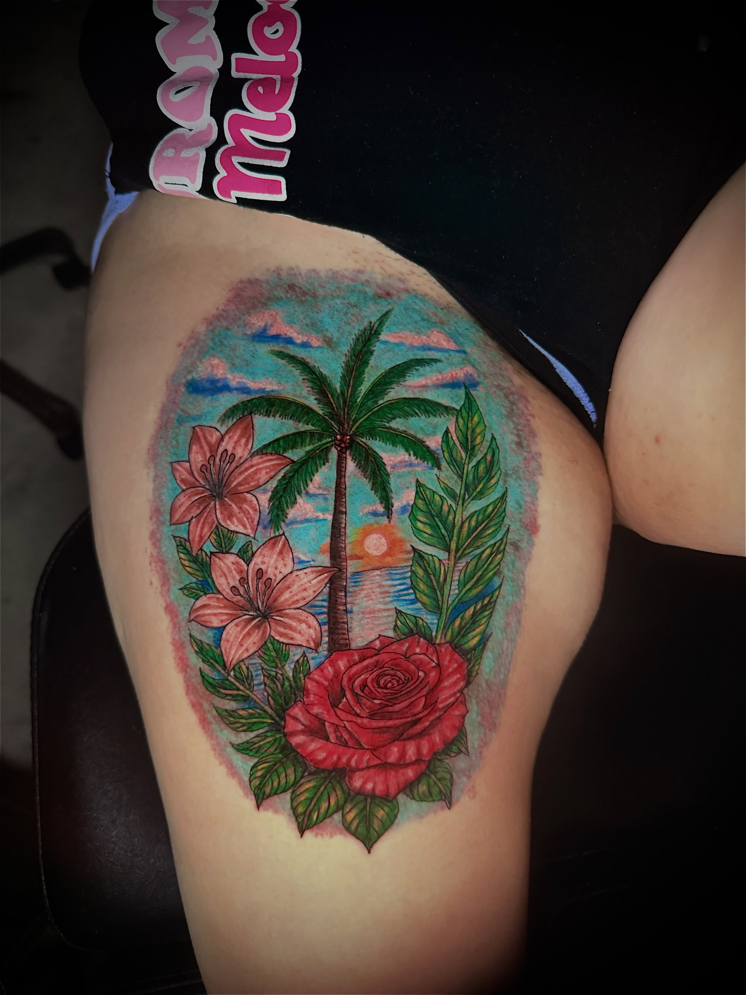 Beach scene realism tattoo on the thigh by Junior Sanchez Dfw