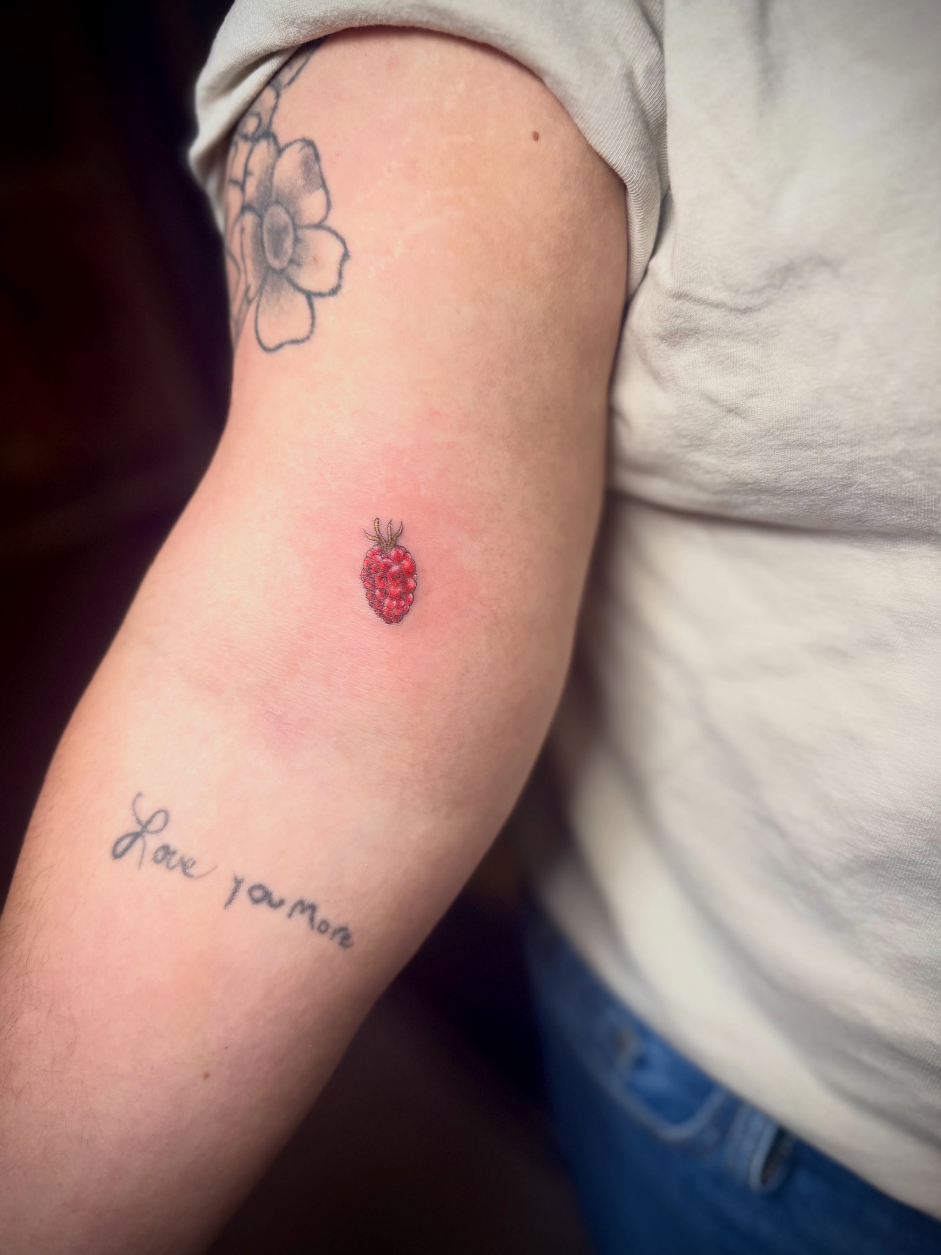 Raspberry dotwork tattoo on the forearm by Kylie Allen