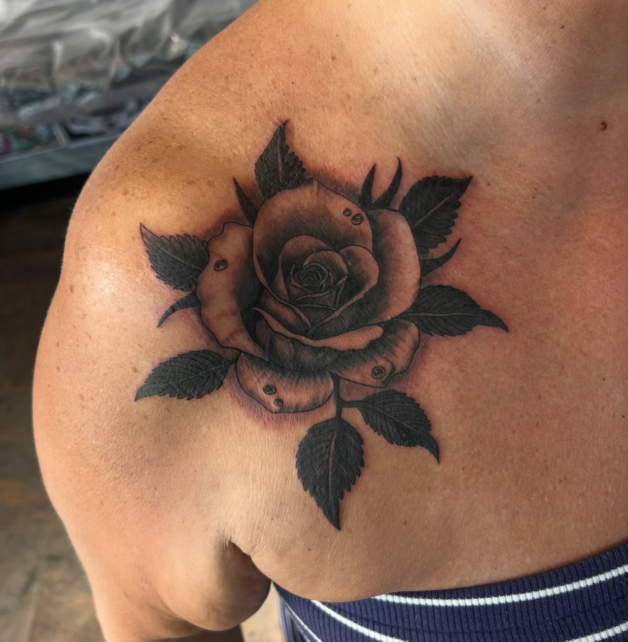 Rose black and grey tattoo on the shoulder by Randy Bray