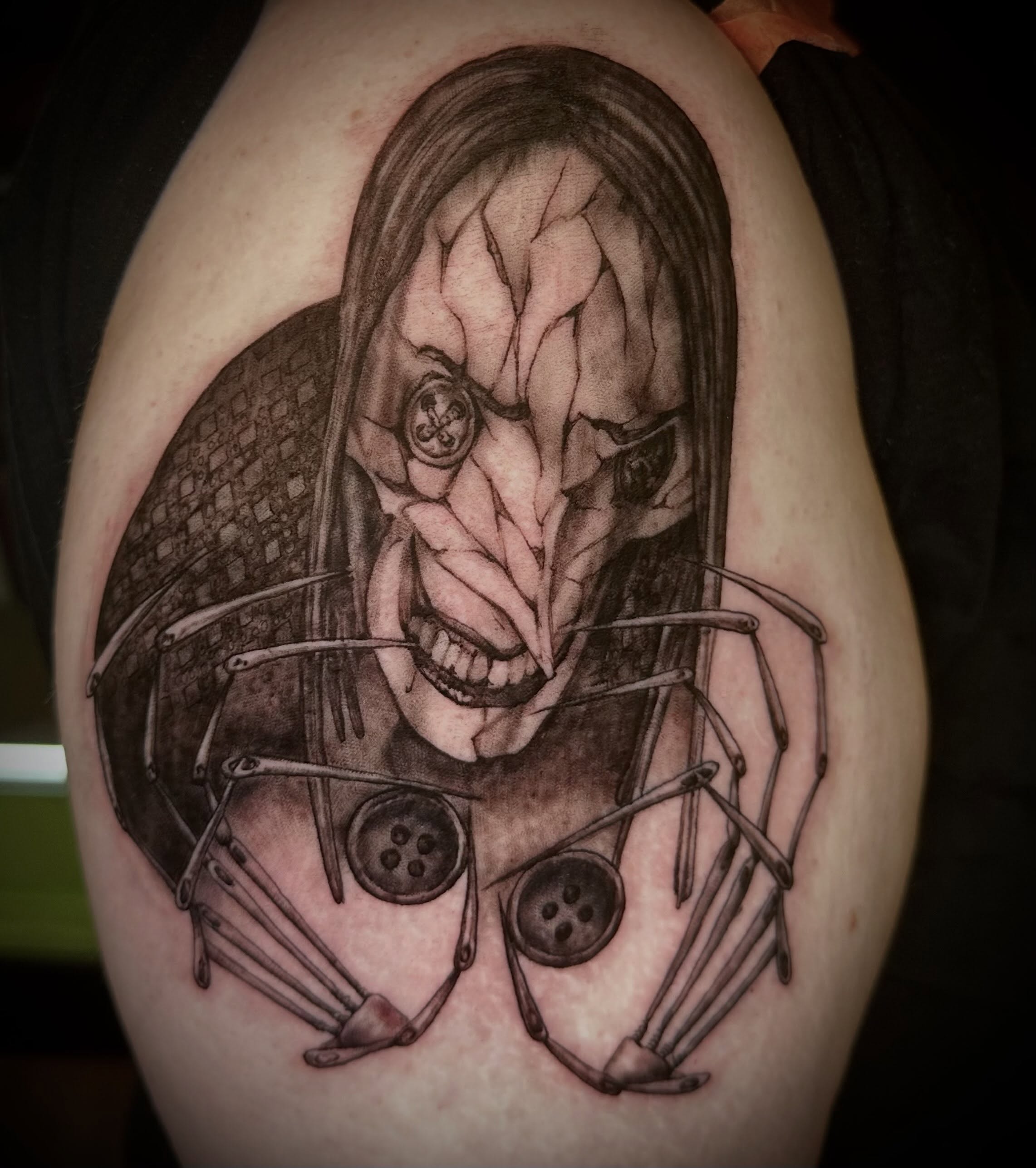 Mask with mechanical elements dark realism tattoo on the shoulder by Alan