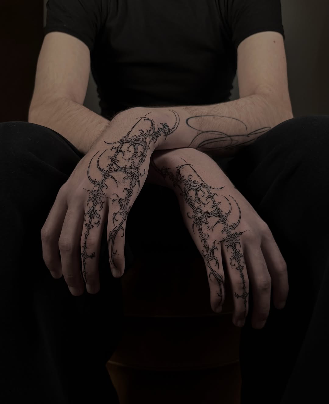 Scrollwork black and grey tattoo on the hand by Cybersigilism & Fineline Blackwork