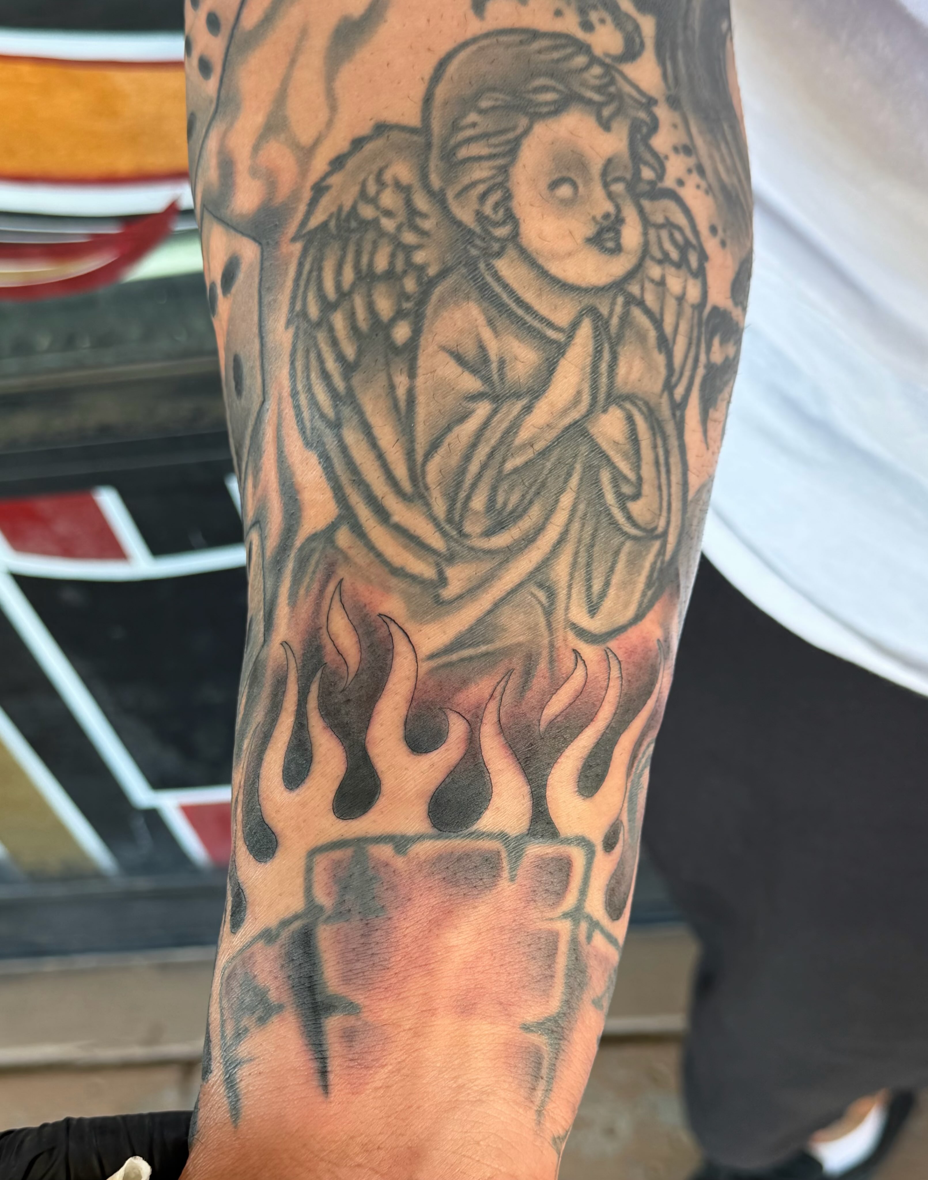Angel black and grey tattoo on the forearm by @sloanxkettering