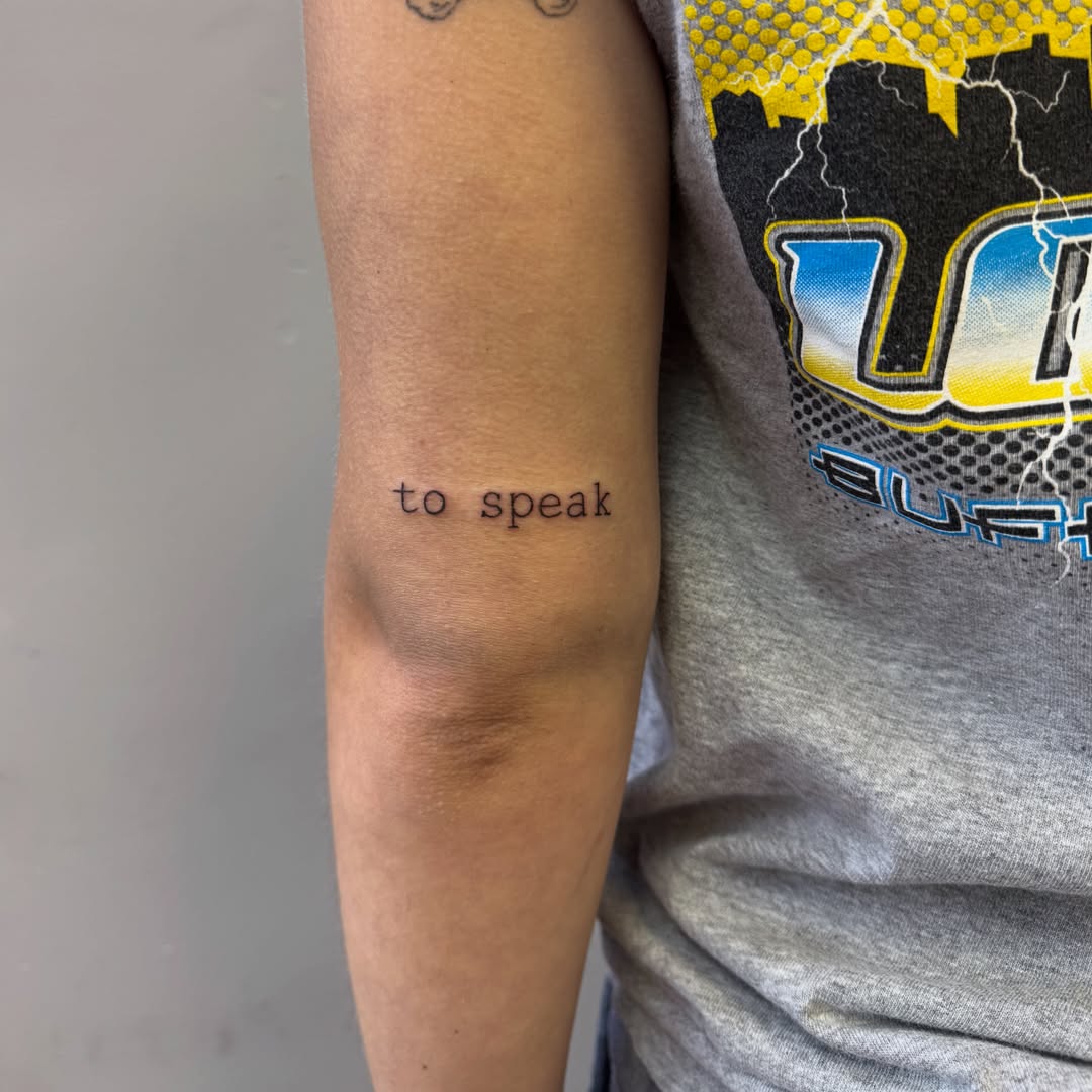 To speak lettering script tattoo on the forearm by 𝕽𝖆𝖈𝖍𝖊𝖑 𝕽𝖆𝖉𝖎𝖈𝖆𝖑 Queens Tattooer