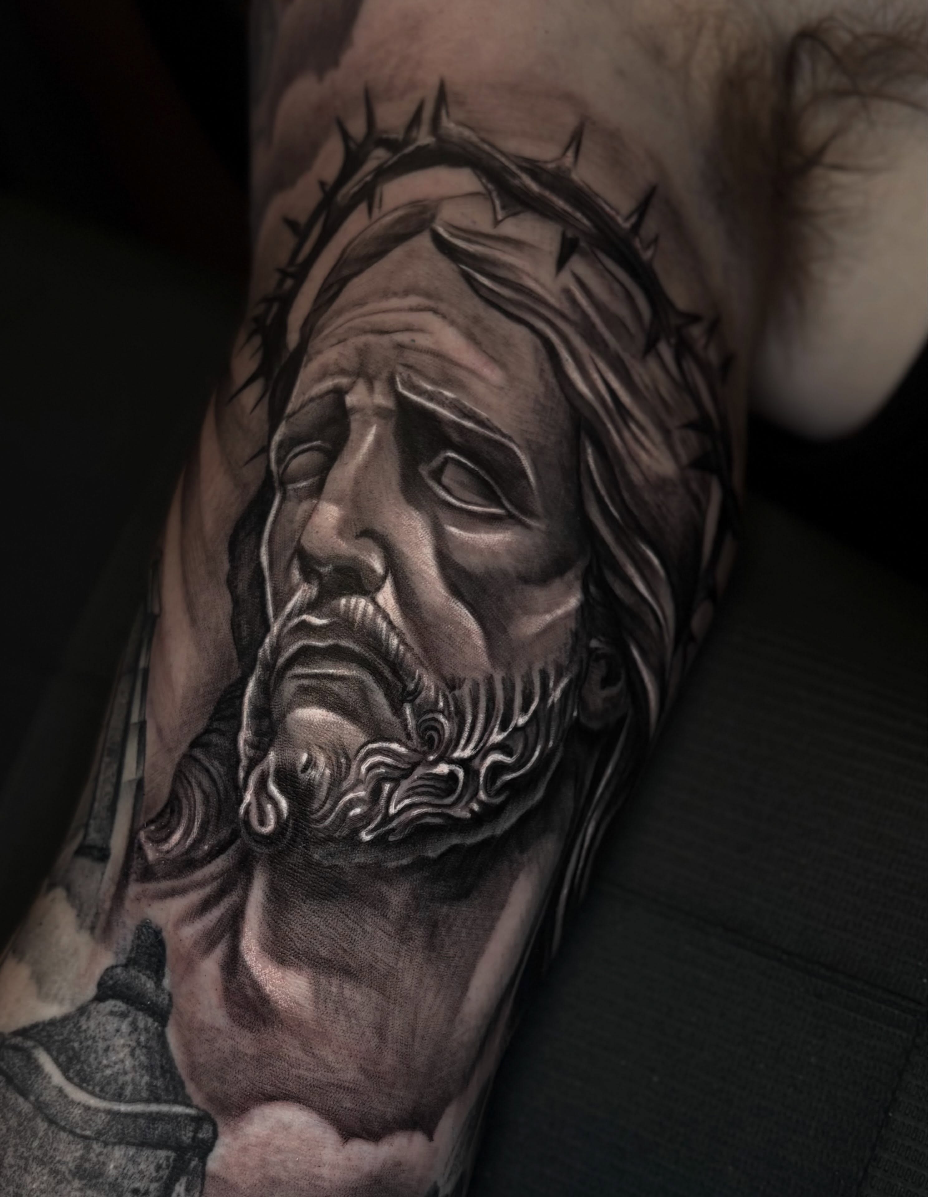 Religious figure realism tattoo on the forearm by Joel Ortiz Ginorio