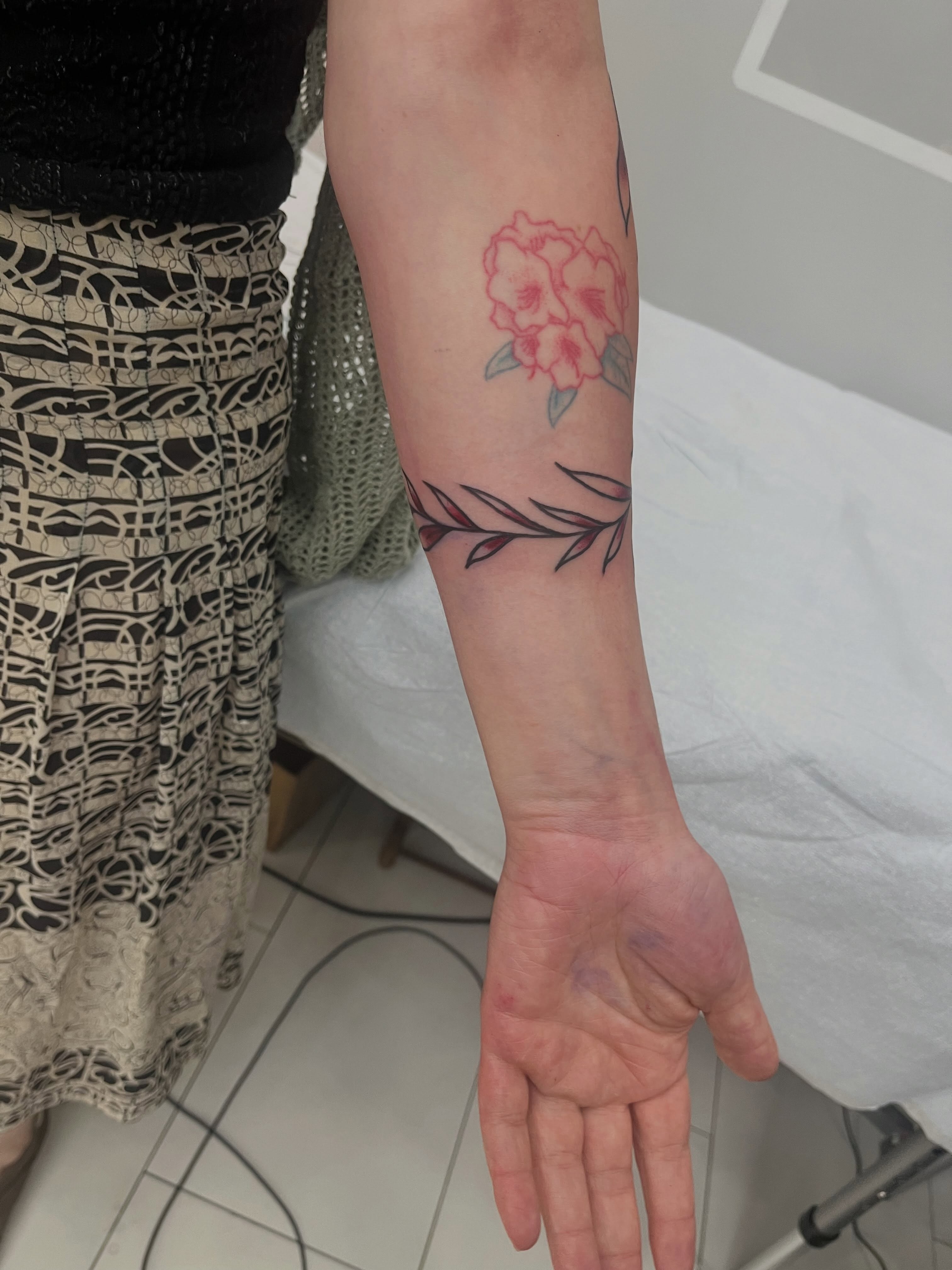 Flower and branch black and grey tattoo on the forearm by Sour Tattoo, Somerville, Massachusetts