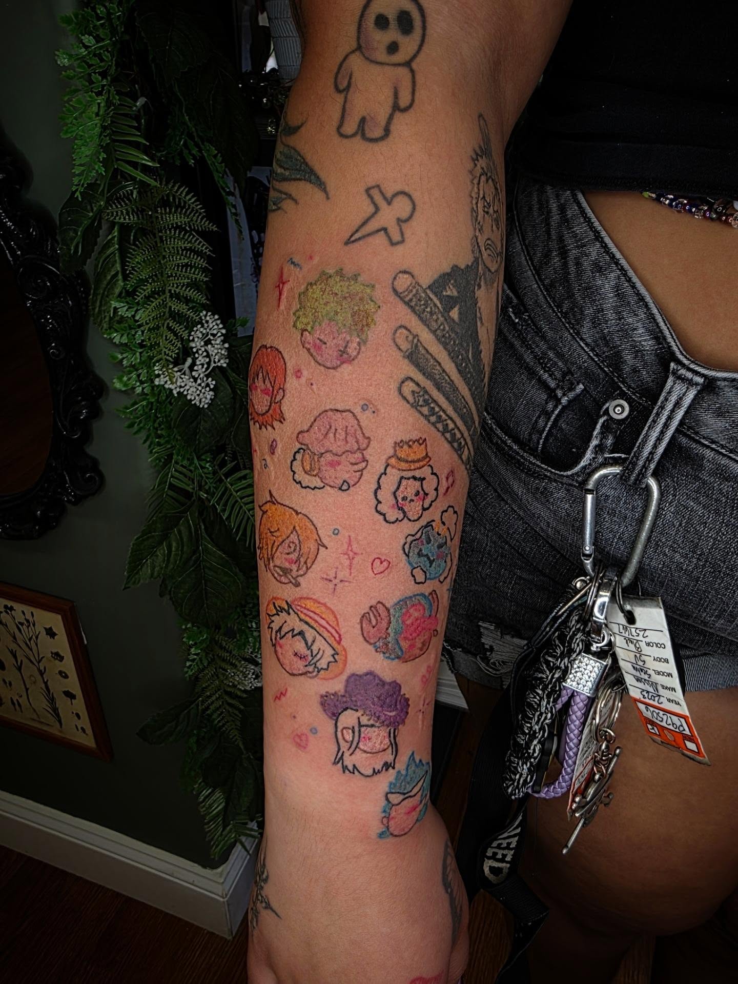 Anime characters anime tattoo on the forearm by julian