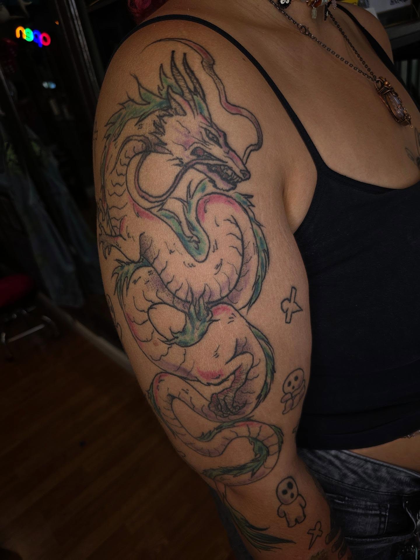 Dragon dotwork tattoo on the upper arm by julian