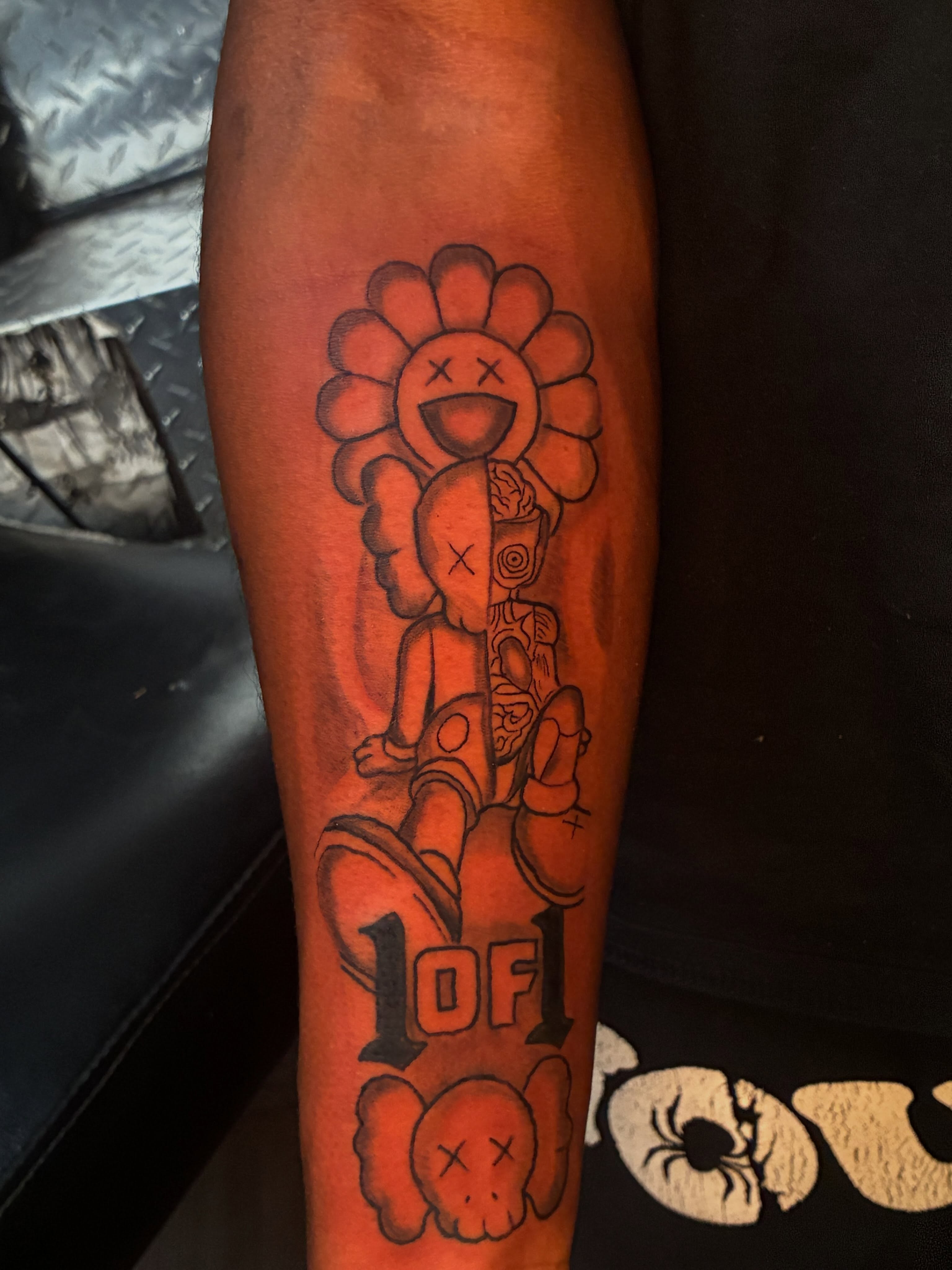 Flower and skull new school tattoo on the forearm by Trae