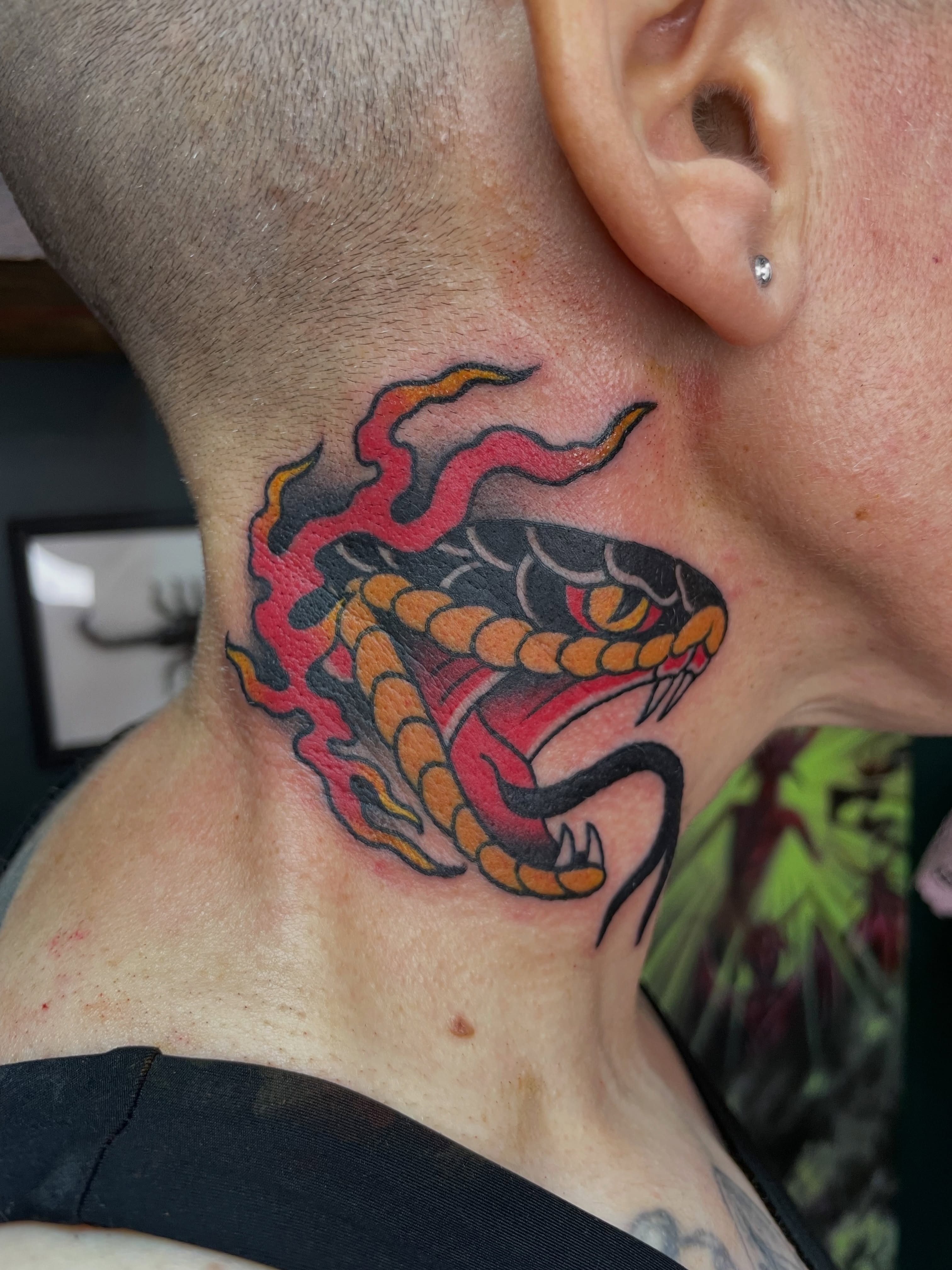 Snake American traditional tattoo on the neck by Tom Taylor, Philadelphia, Pennsylvania