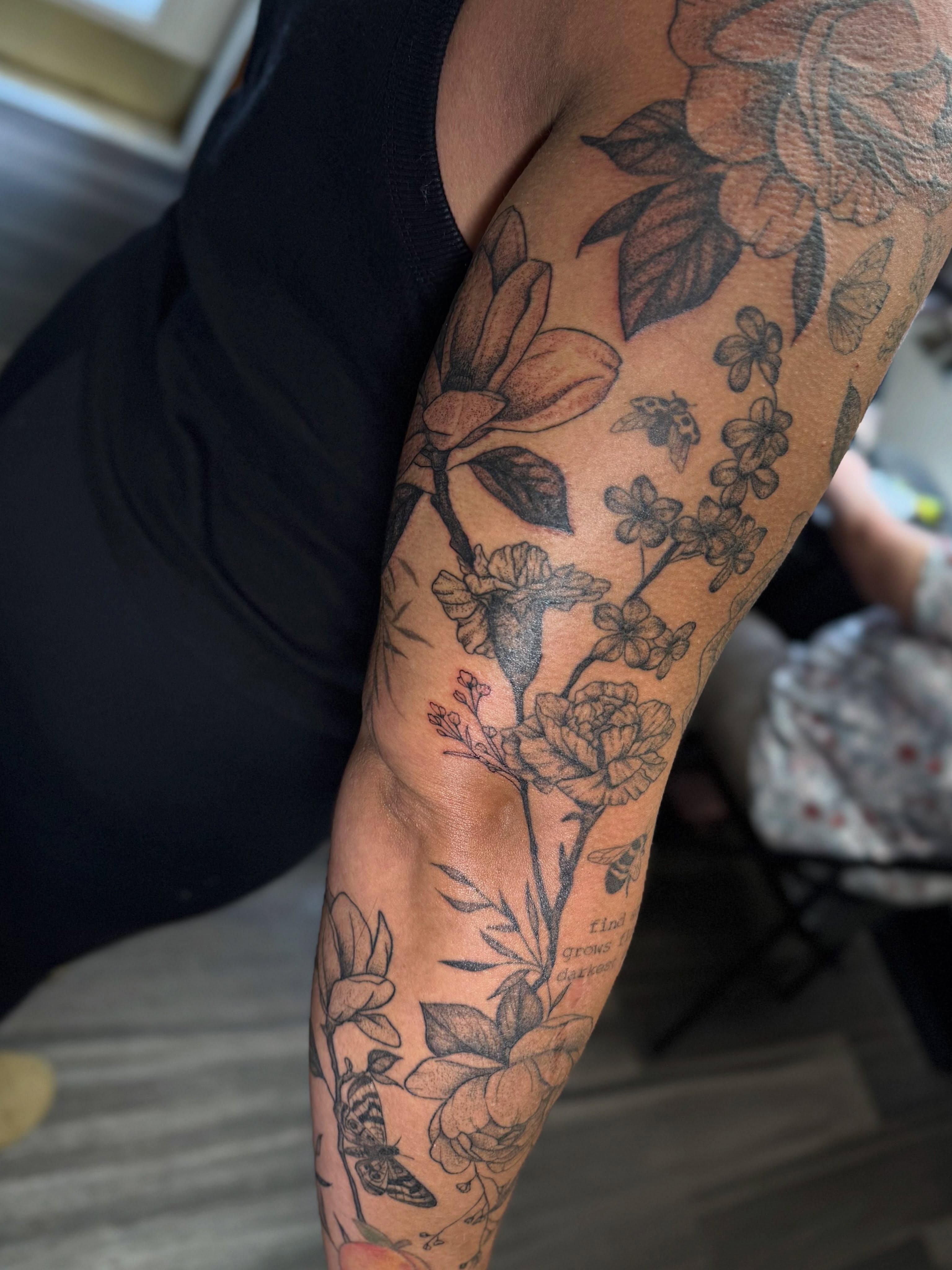Floral arrangement black and grey tattoo on the forearm by βπ¬π―π’πΆ