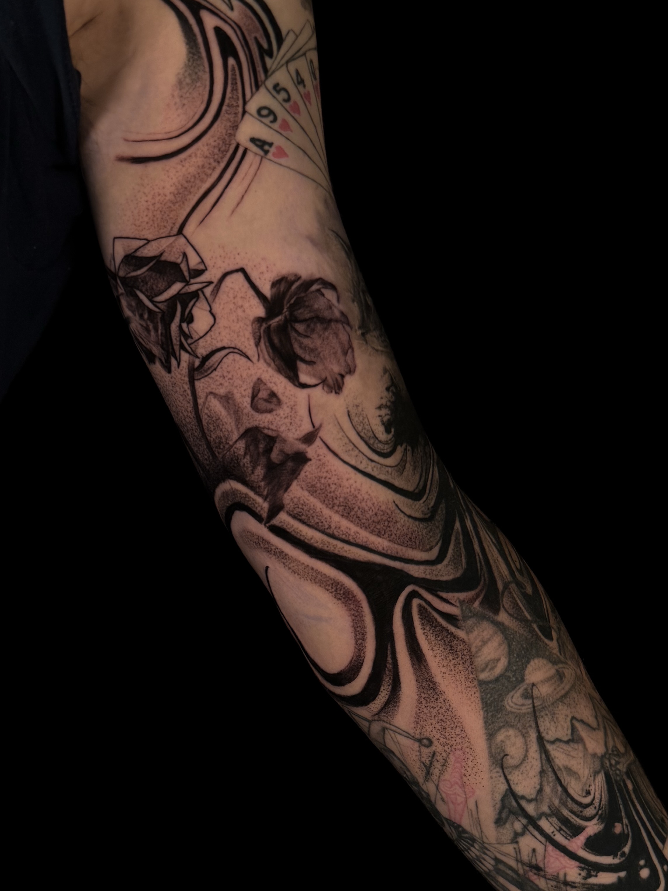 Abstract floral dotwork tattoo on the forearm by Vince Lau