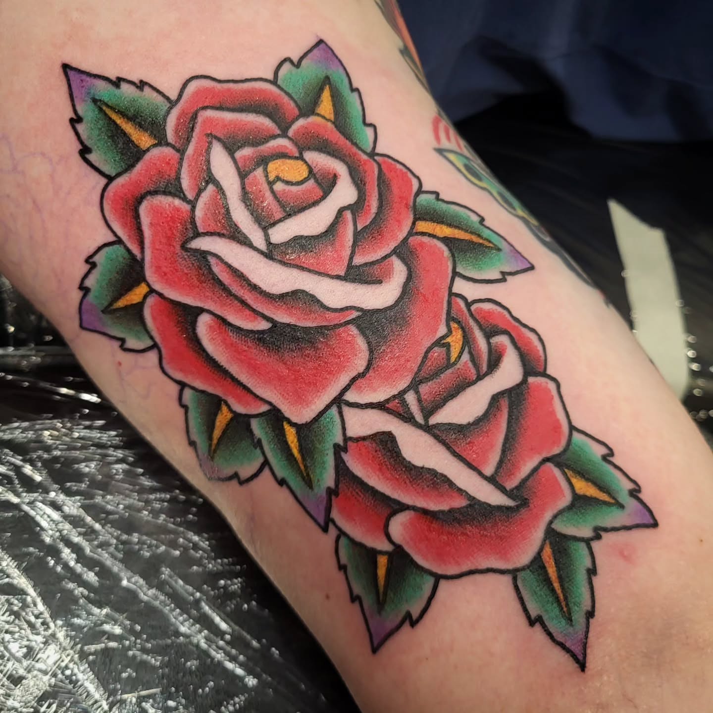 Roses American traditional tattoo on the forearm by Sloan Smith