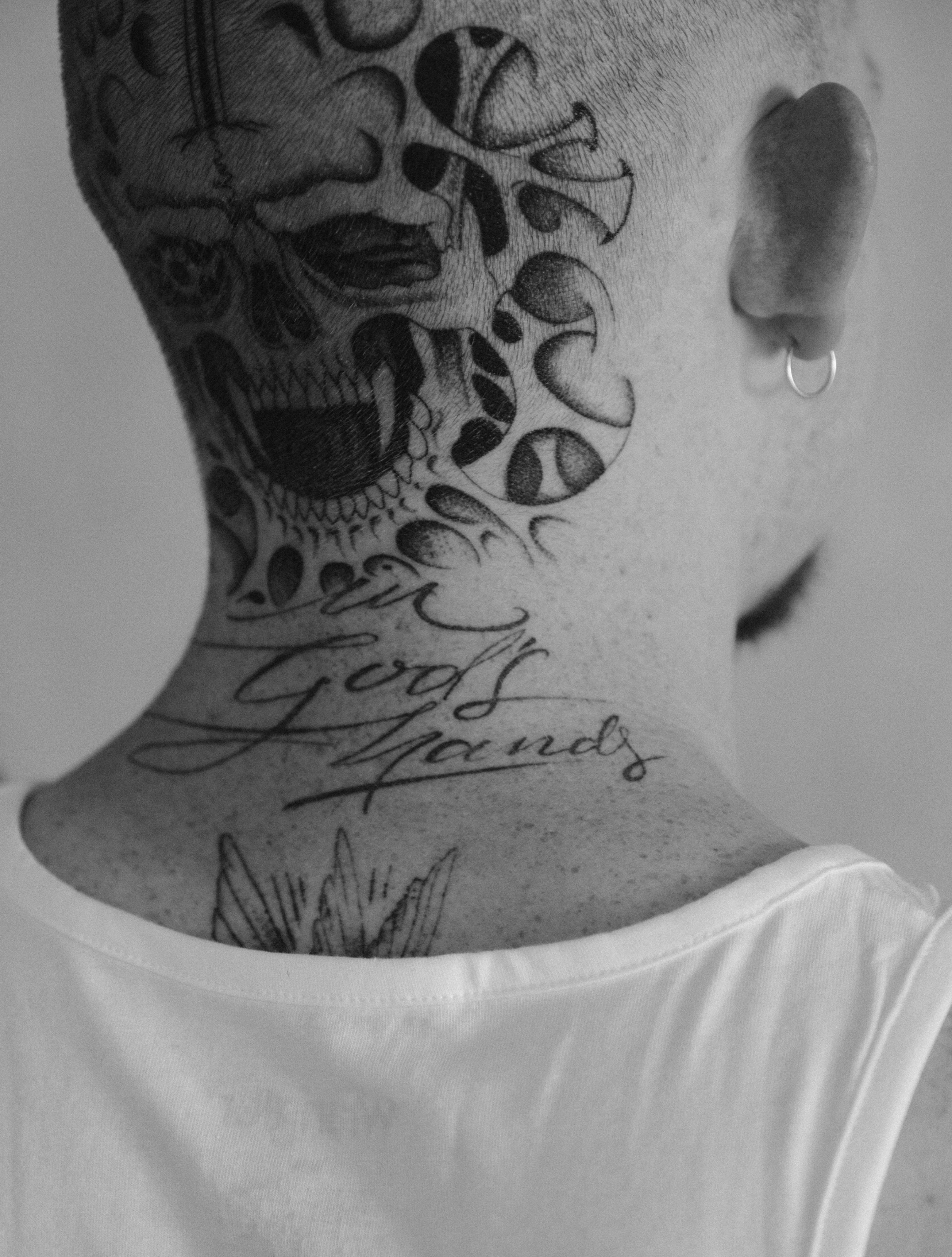Skull and script realism tattoo on the neck by Ethan Ellis, Dallas, Texas