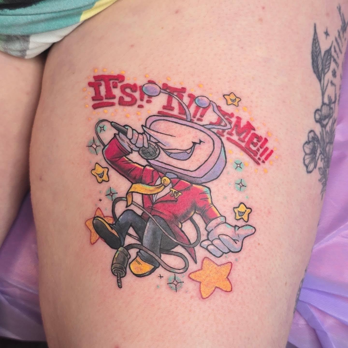 Cosmic character illustrative tattoo on the thigh by Val Sanchez