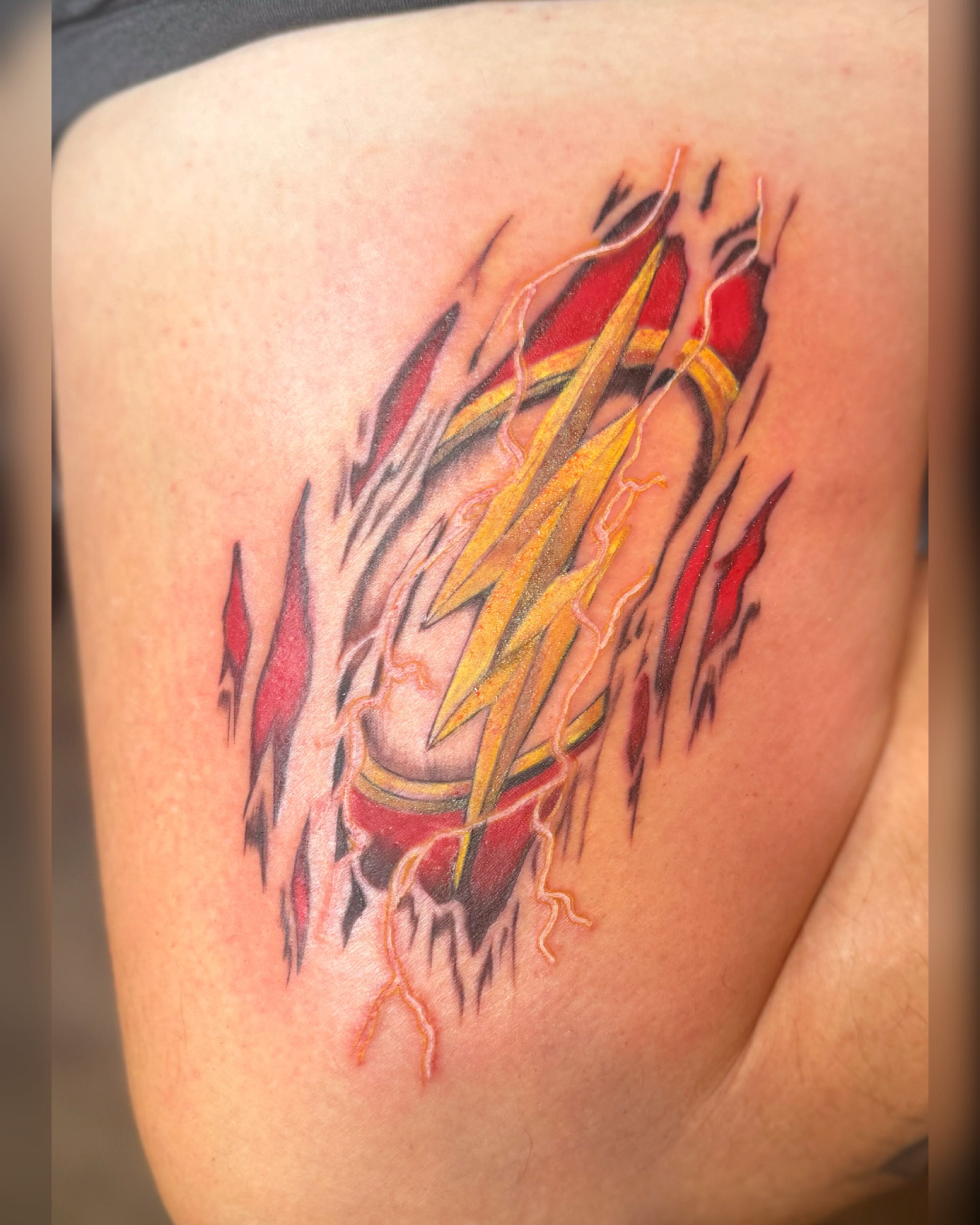 Lightning bolt new school tattoo on the thigh by Chris Adkins Tattoos, Chattanooga, Tennessee