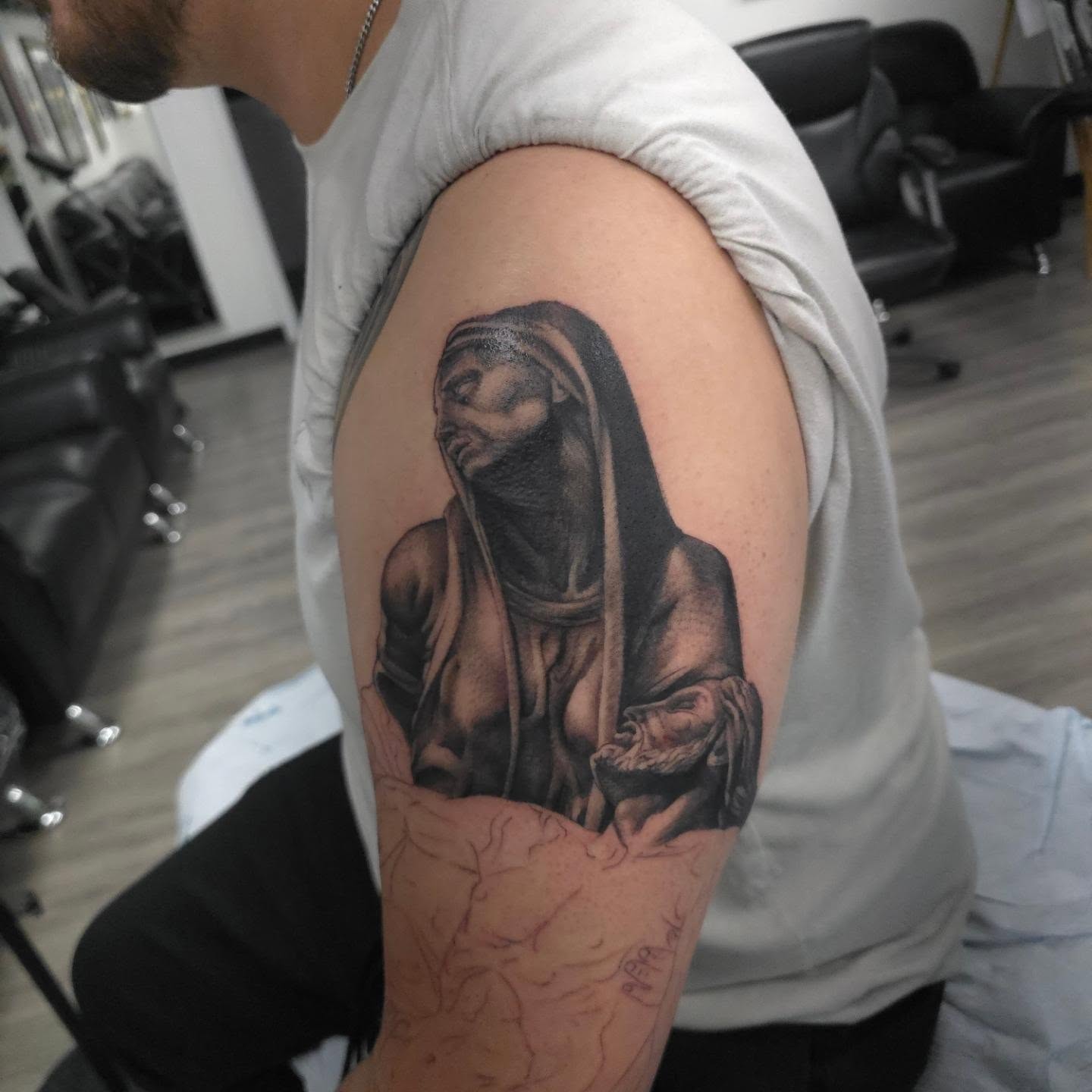 Woman in hood realism tattoo on the shoulder by Joseph J Tattooart Denver, Lakewood, Colorado