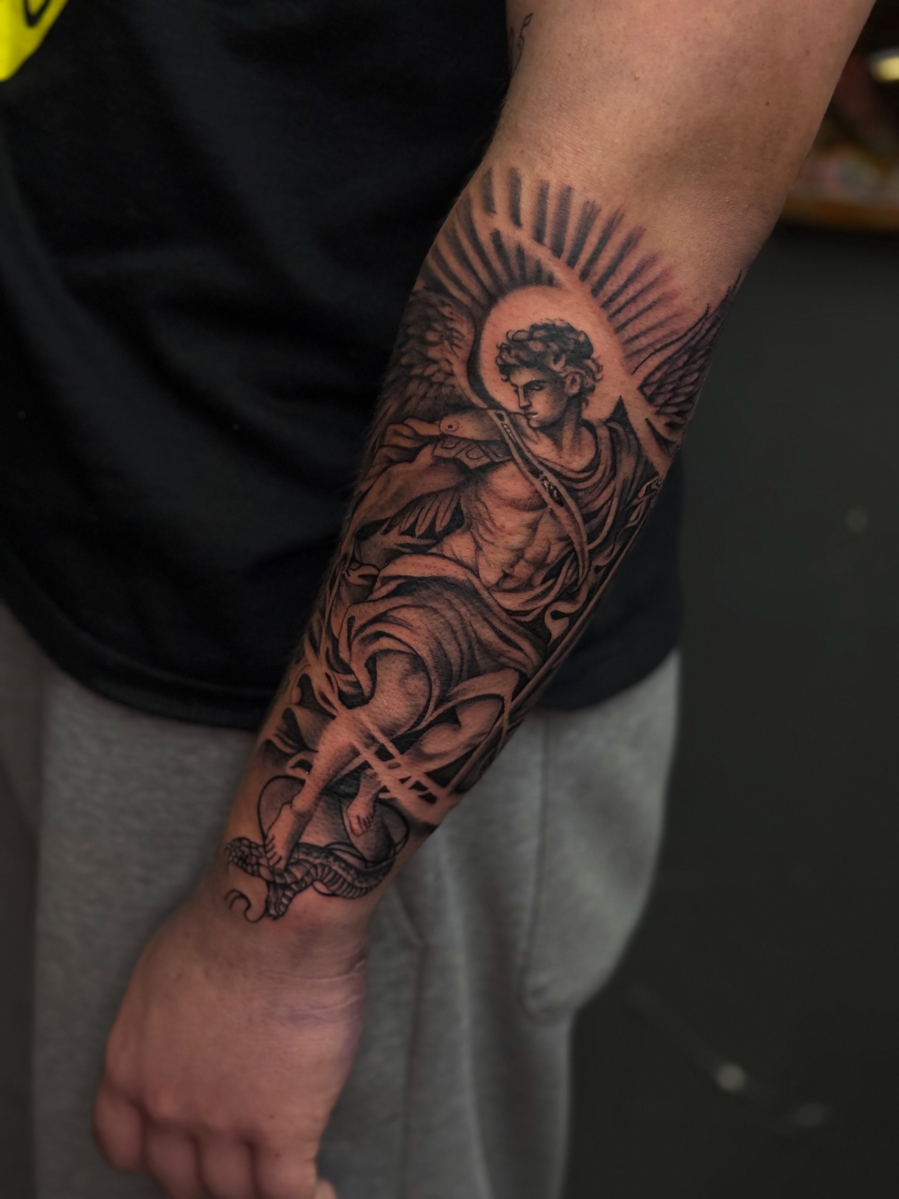 Angel with snake realism tattoo on the forearm by Smuk One