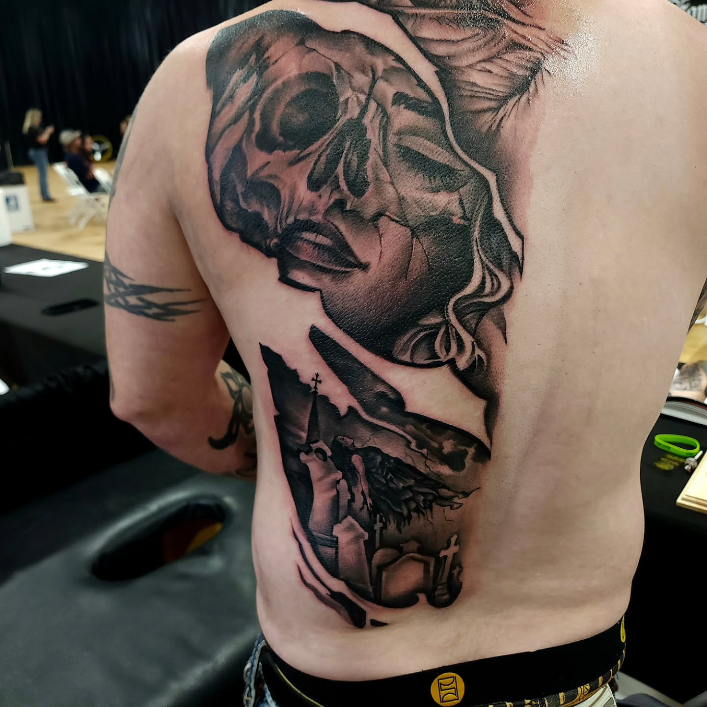 Skull and woman realism tattoo on the back by Chris Wodarski