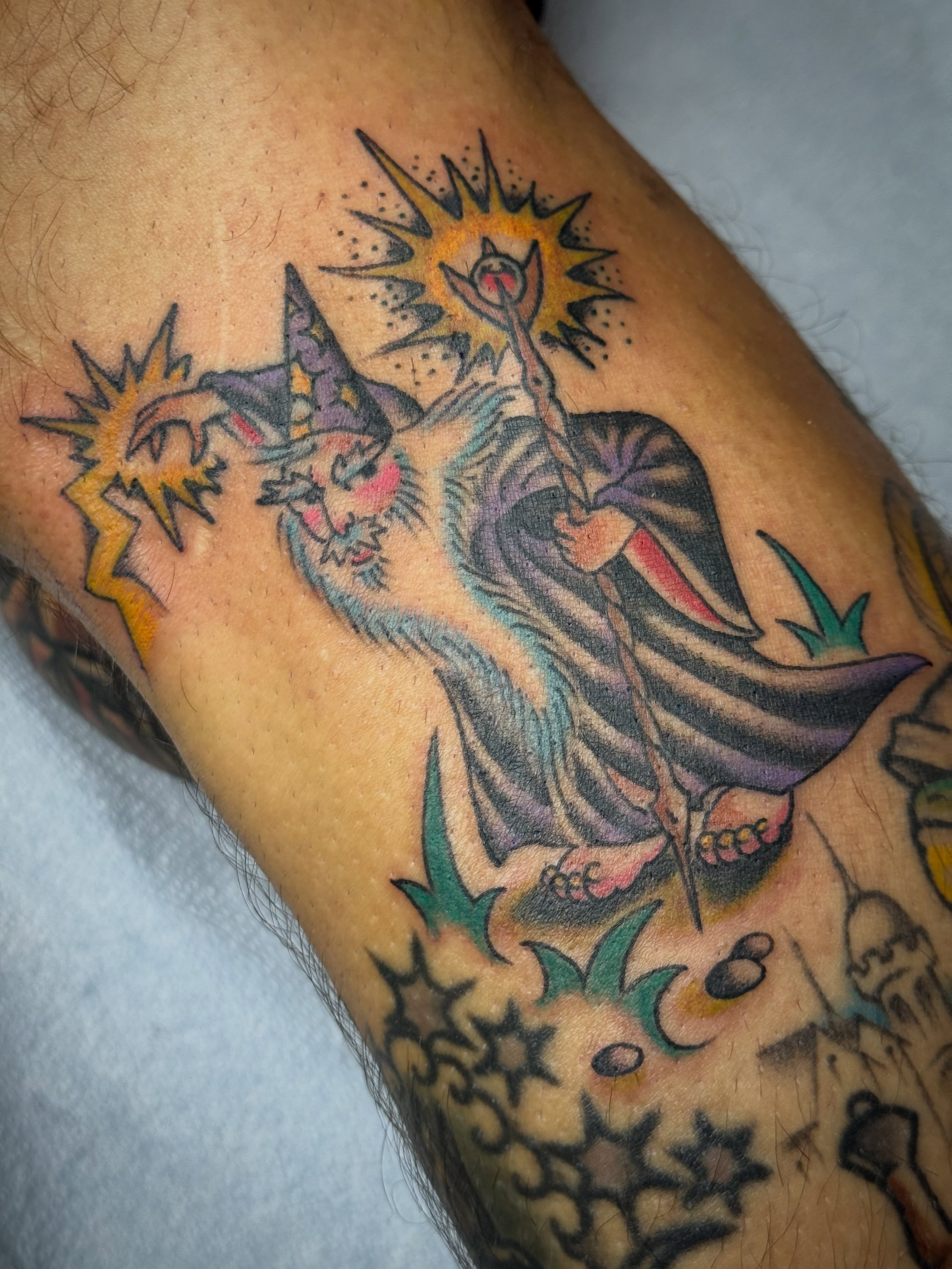 Wizard casting spell American traditional tattoo on the forearm by B