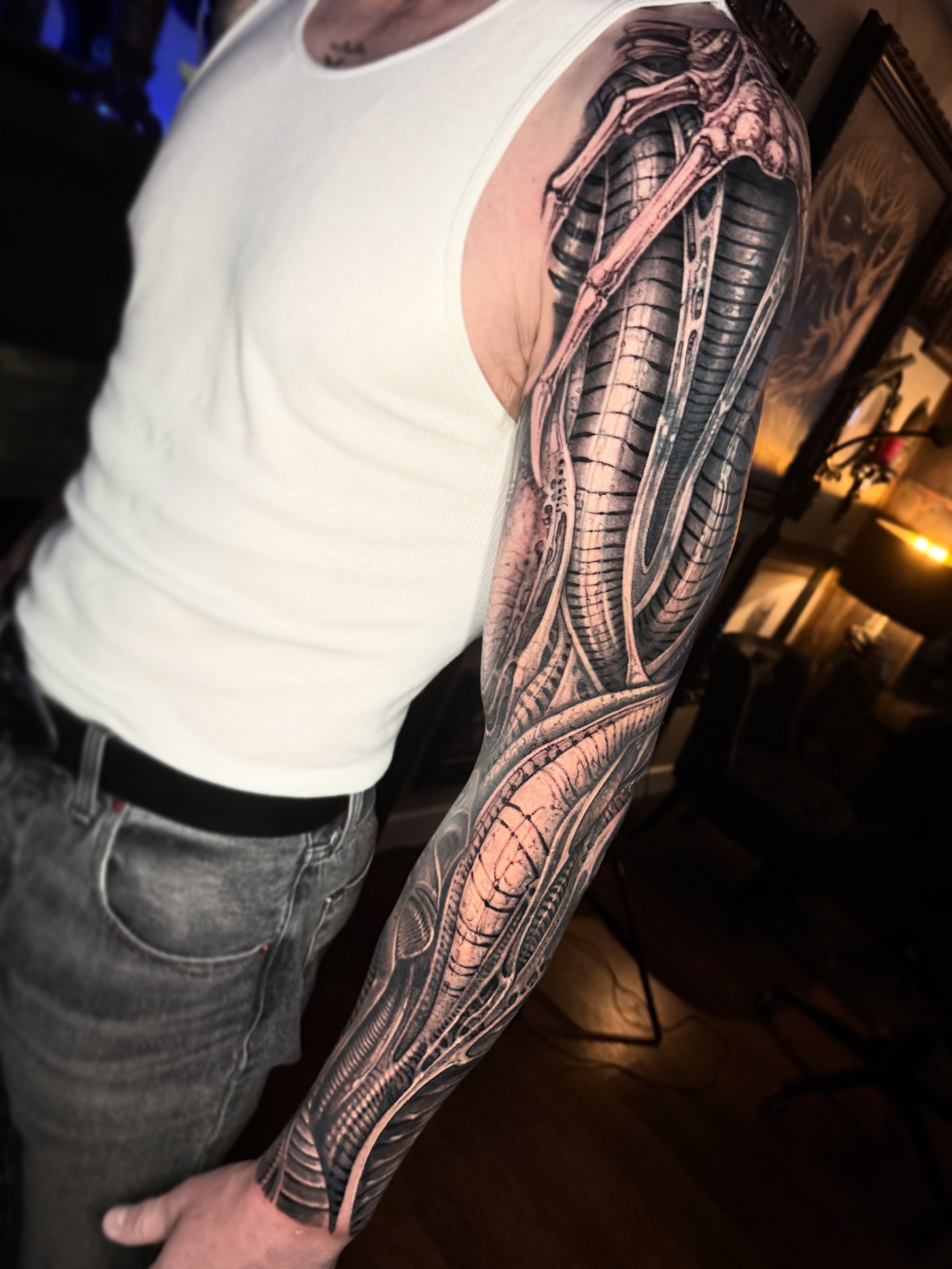 Biomechanical structure realism tattoo on the upper arm by Jeremiah Barba