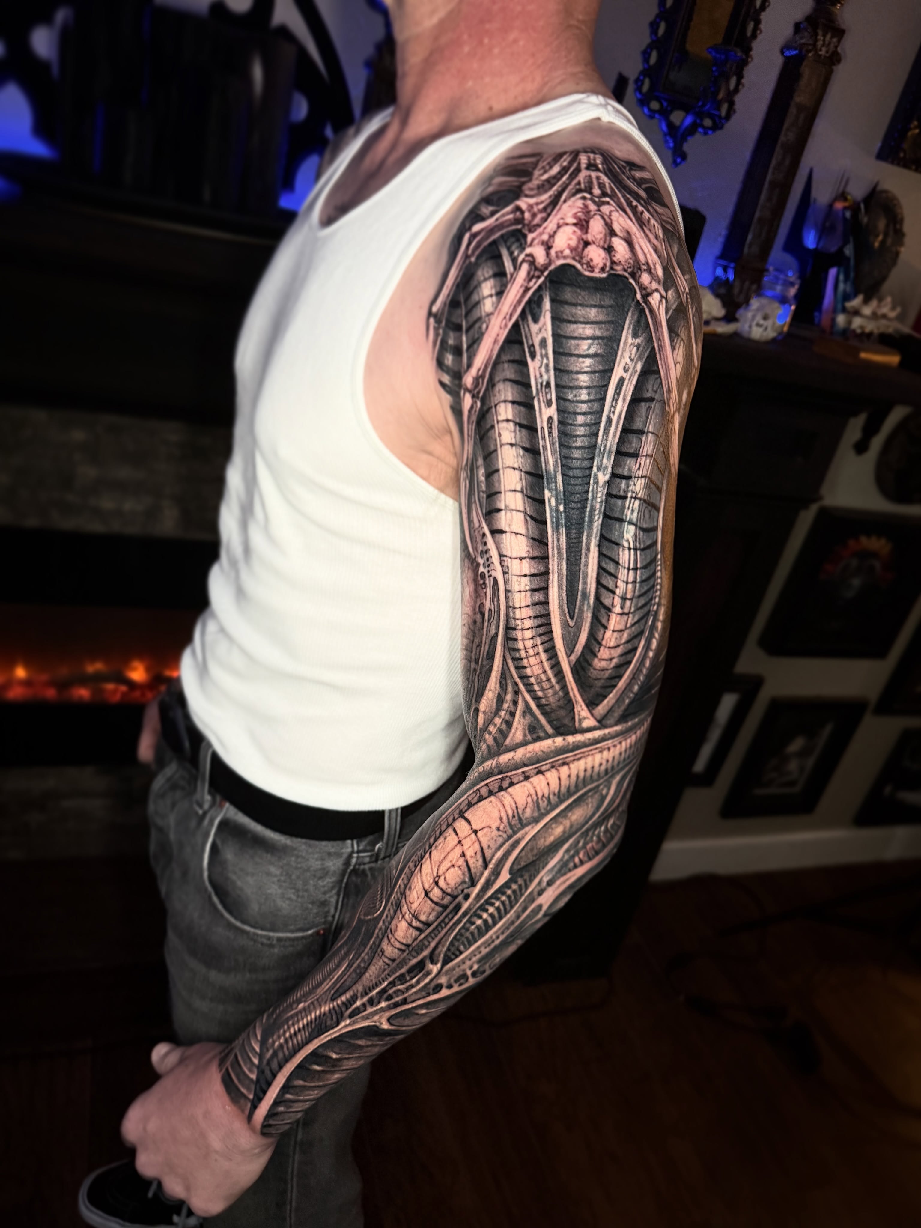 Biomechanical structure realism tattoo on the upper arm by Jeremiah Barba