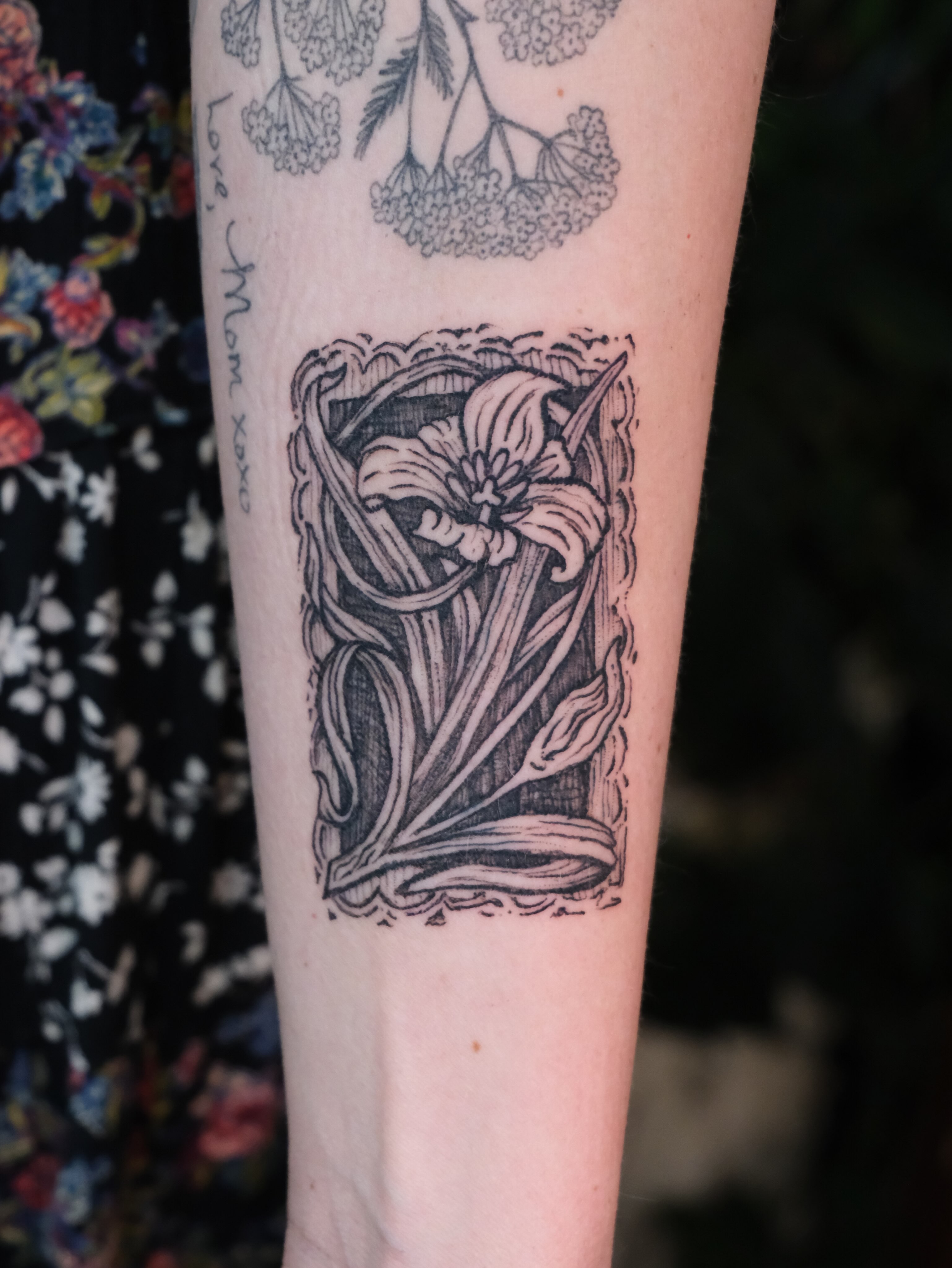 Lily black and grey tattoo on the forearm by Renee (Koi) Vance