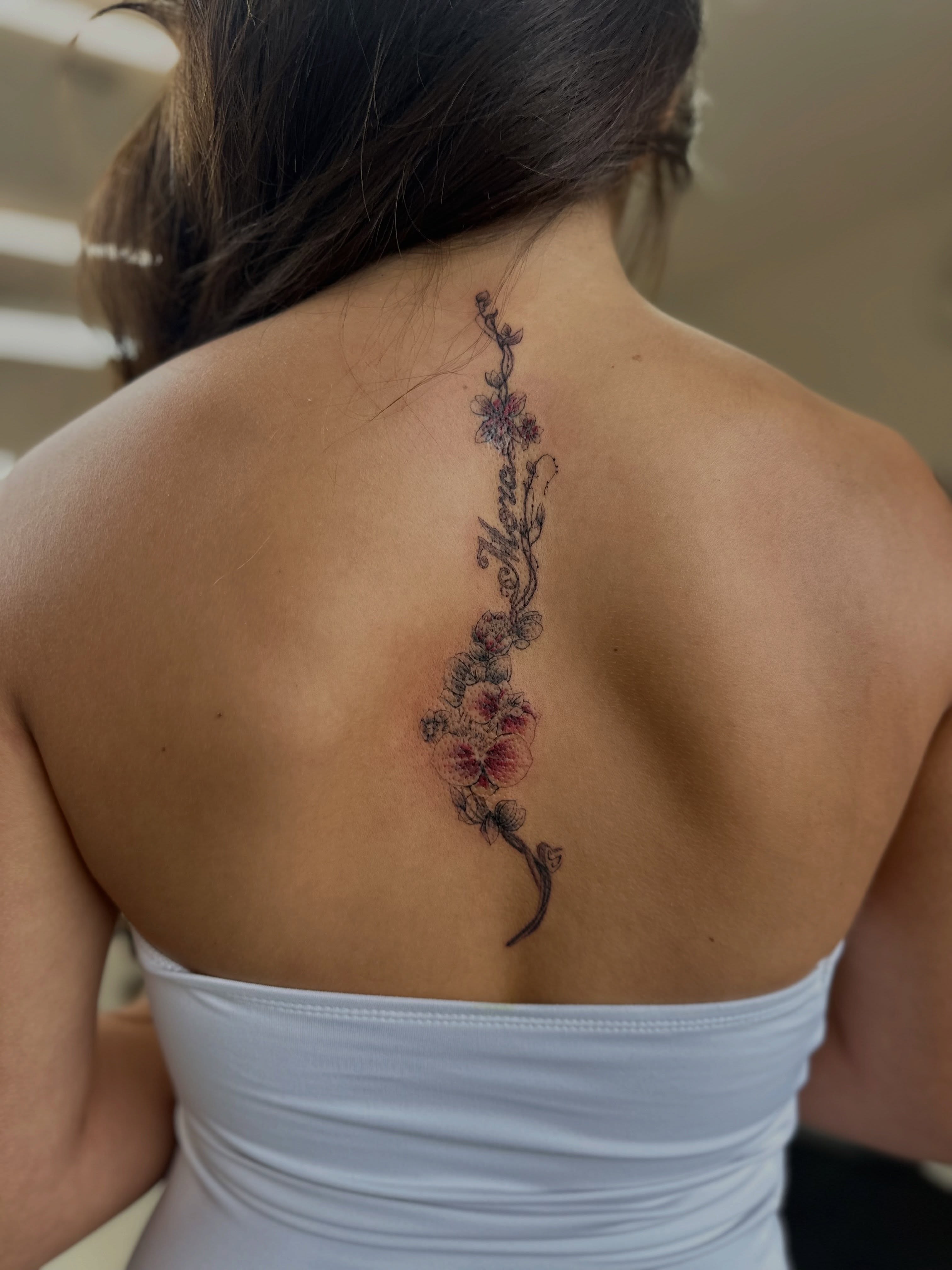 Flower vine black and grey tattoo on the back by Ric Castellon Tattoo Artist, Los Angeles, California
