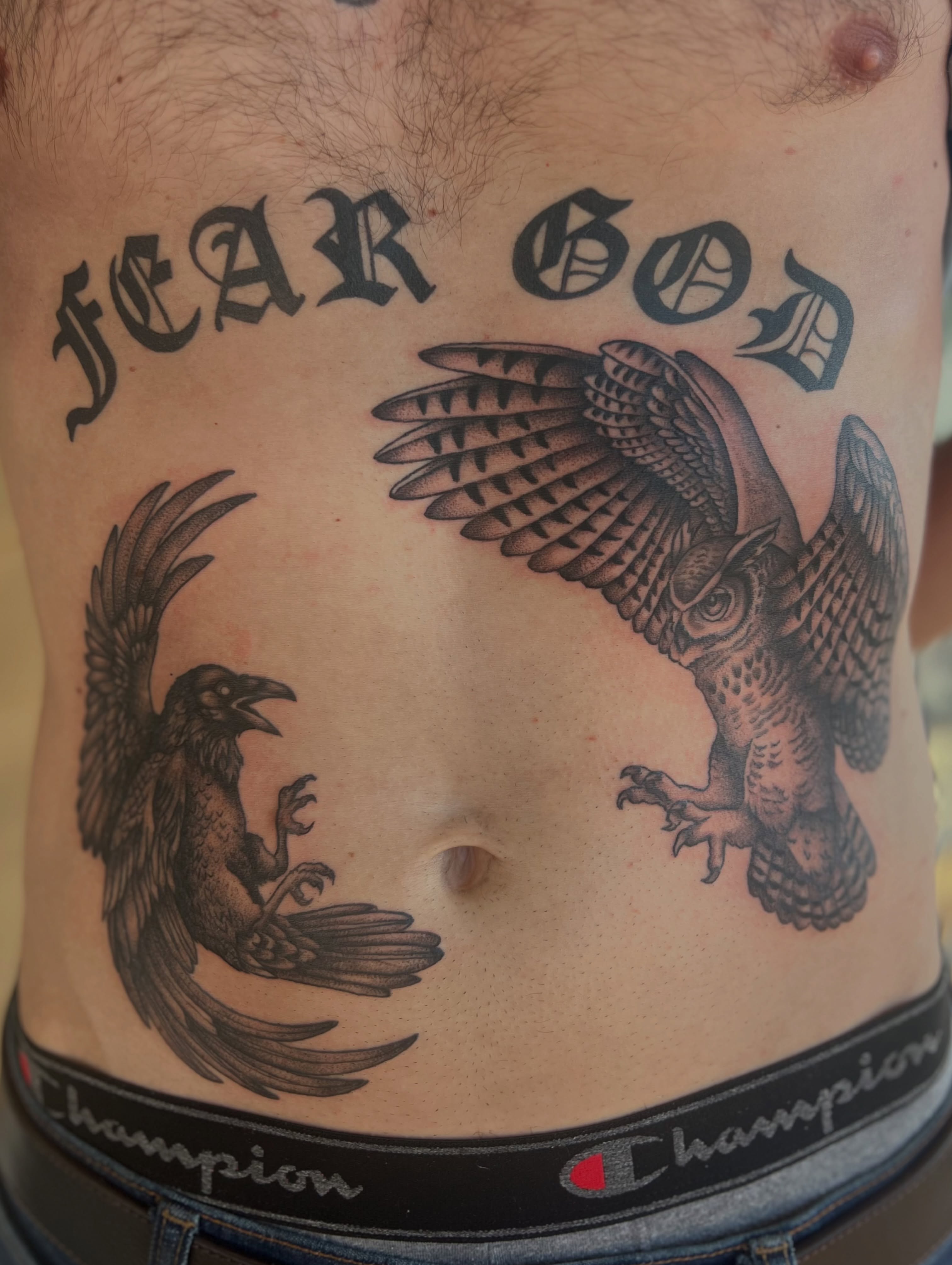 Raven and eagle realism tattoo on the torso by Jai Woods
